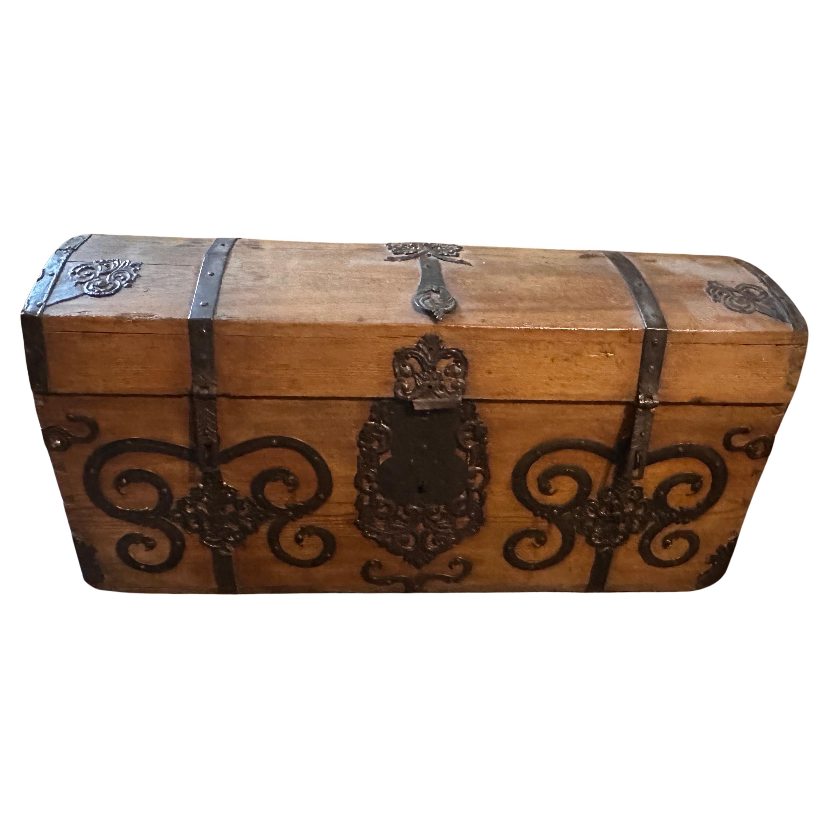 A Spanish Noble Carriage Trunk Dated on the top 1742 inside the iron family crest, it's in original condition. This carriage trunk dated 1742 it's a remarkable and historically significant piece of furniture that combines the craftsmanship and
