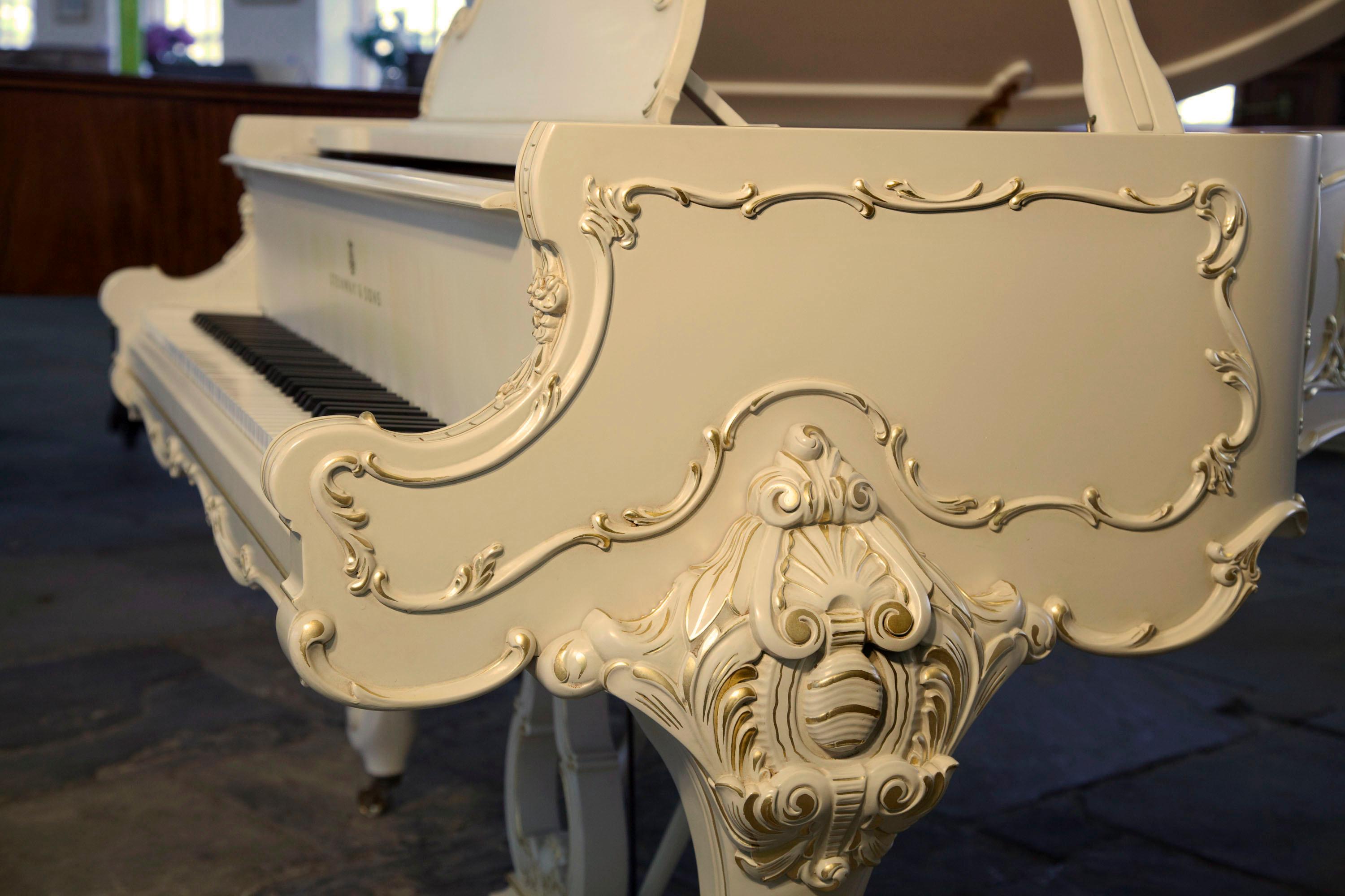 Special Collection, Louis XV, 1979, Steinway Model O grand piano with a Rococo style, matt, cream coloured case. Piano has ornately carved, cabriole legs with scroll feet. Leg top carved with scrolling acanthus, cabuchon and a palmette in high
