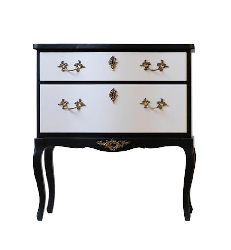A single antique Rococo commodes renovated to the highest standard and custom painted to provide a modern interpretation. Matte black with white drawers. 
Width: 62cm / 24.4