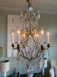 Rococo style brass and crystal chandelier