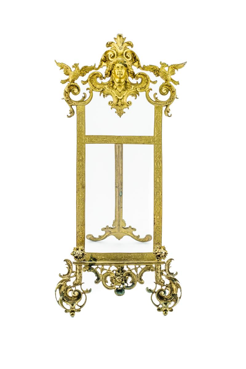 Beautiful French Rococo style table easel or book stand made of bronze. Easel can be used also as a stand for picture or small painting, France, 1920s.
Measures: Height 55 cm / 21.6 in; width 24 cm / 9.4 in; depth (opened): 33 cm / 13 in. 
In a