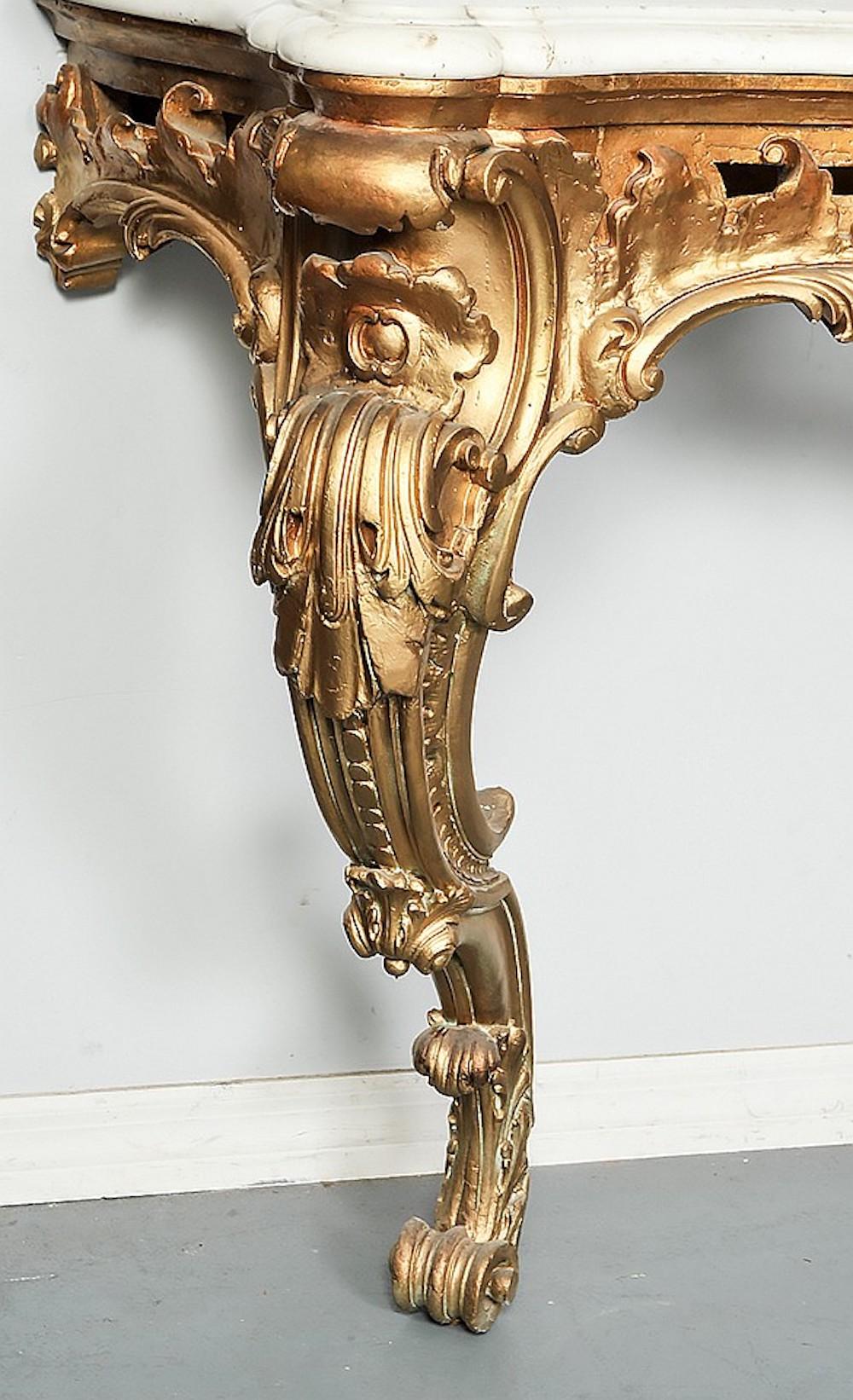 Italian, 19th century. With serpentine fronted marble top above the pierced frieze, raised on cabriole legs. Measures: Height 36 3/4