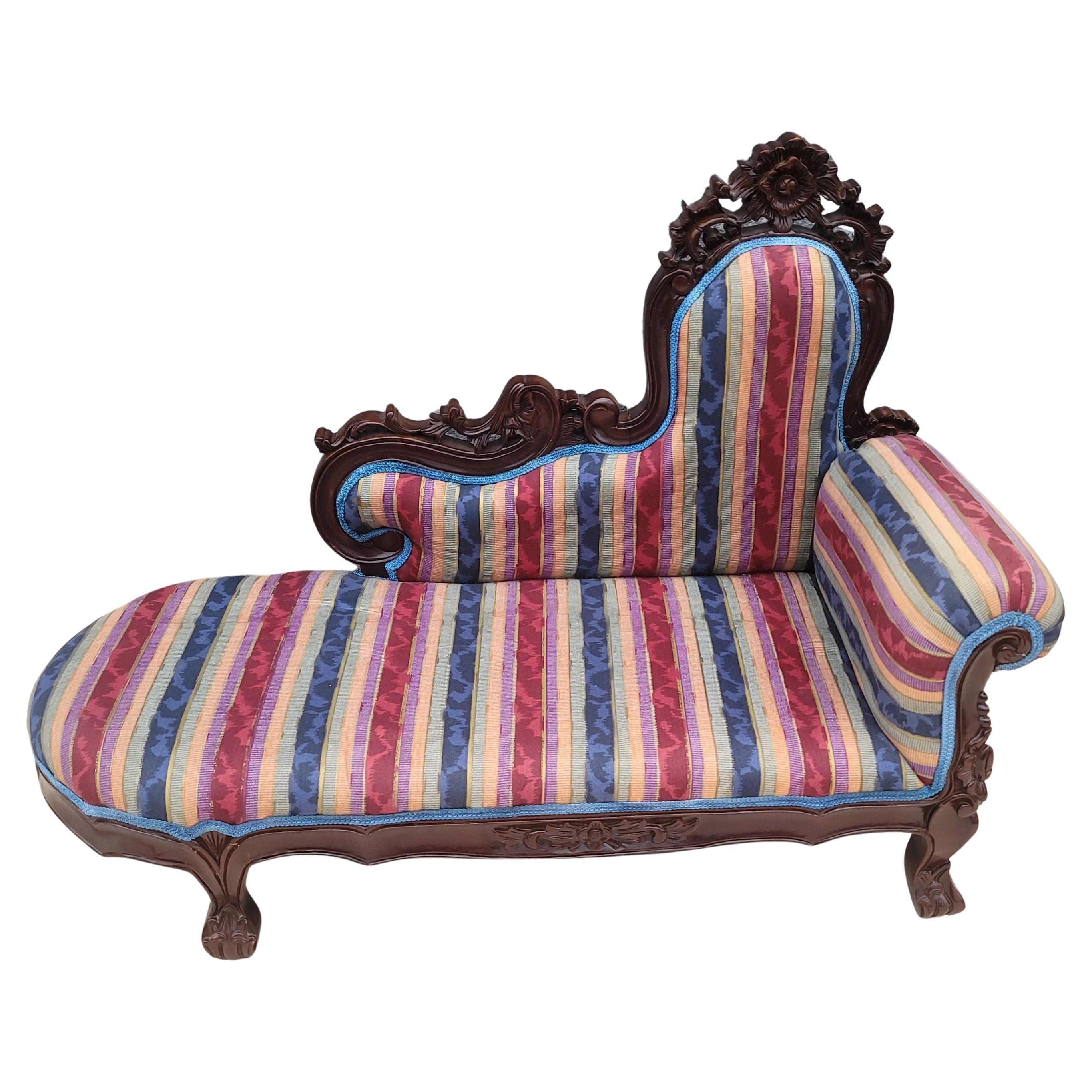 A Rococo style cherry upholstered child size chaise lounge with exquisite carvings and in excellent condition.
Measures 33