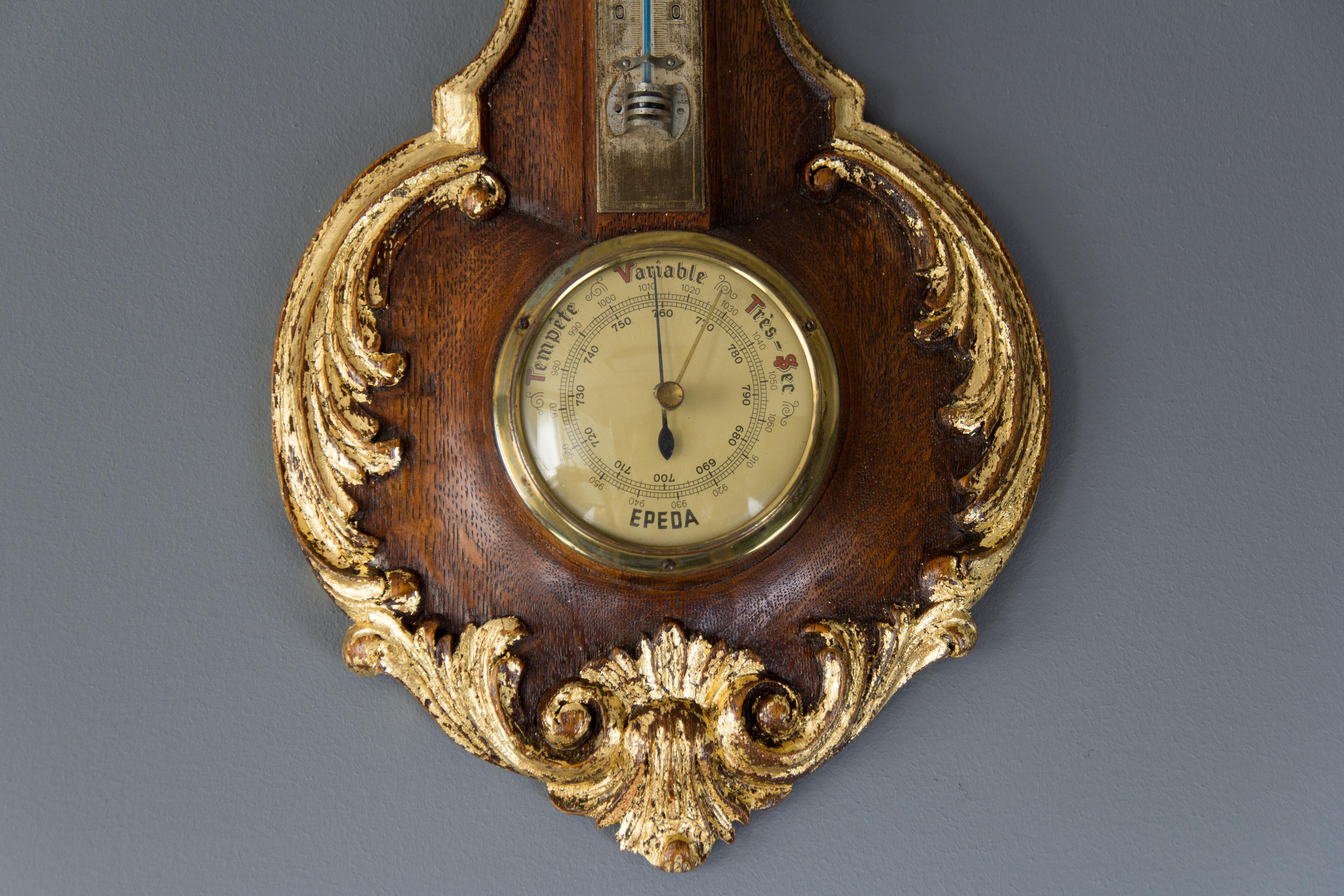 This barometer features a beautifully carved oak-wood frame with Rococo or Louis XV style leaf and rocaille details. Above the barometer, there is a thermometer in Celsius degrees. Europe, the 1920s.
Dimensions: Height 39 cm / 15.35 in, width 20 cm