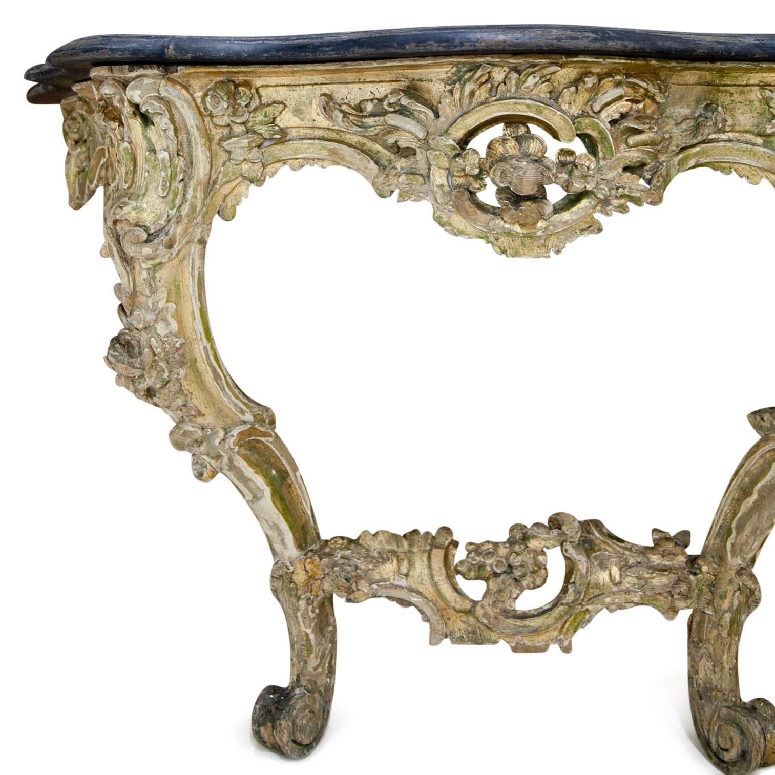 Rococo-style console table with volutes, c-buckles and grape motives. The black painted top shows some wear as well as the gilding.