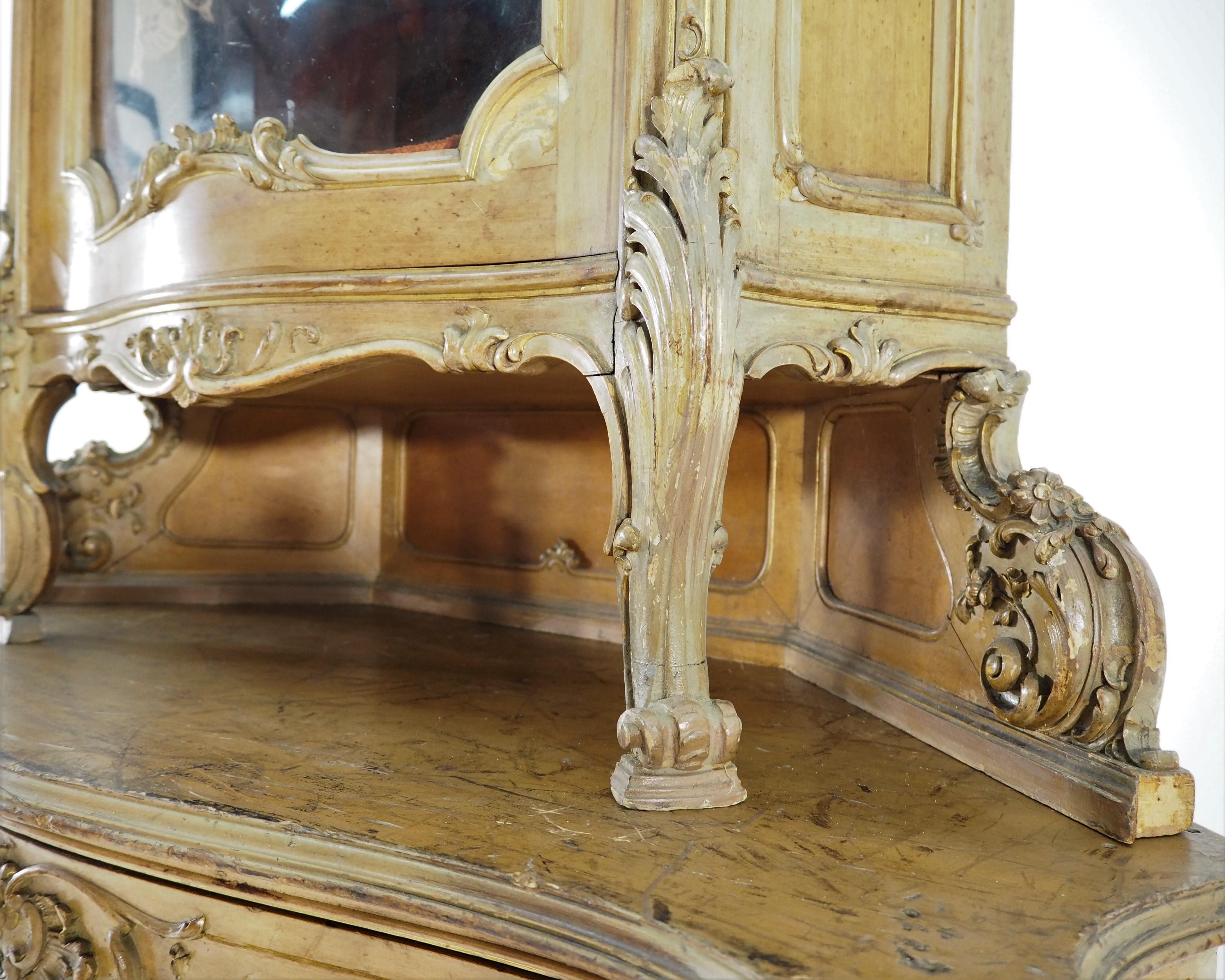Rococo cupboard, 1920s. Original condition. Will look wonderful in a living room or dining room. Its unique form and beautiful shape impresses. Dimensions: Height 195 cm, width 106 cm, depth 52 cm.