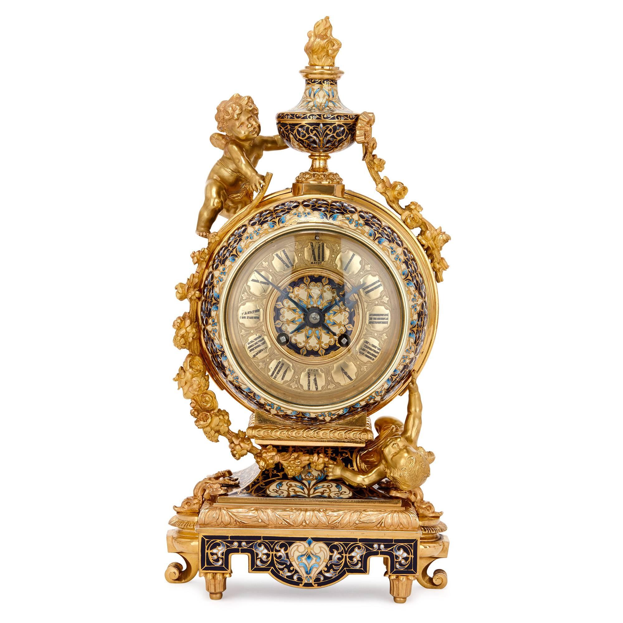 This exquisite five-piece antique French clock set is full of joyful Rococo exuberance and features delightful gilt bronze models of cherubs, together with some incredibly intricate floral cloisonné enamel work. The set consists of a central clock,