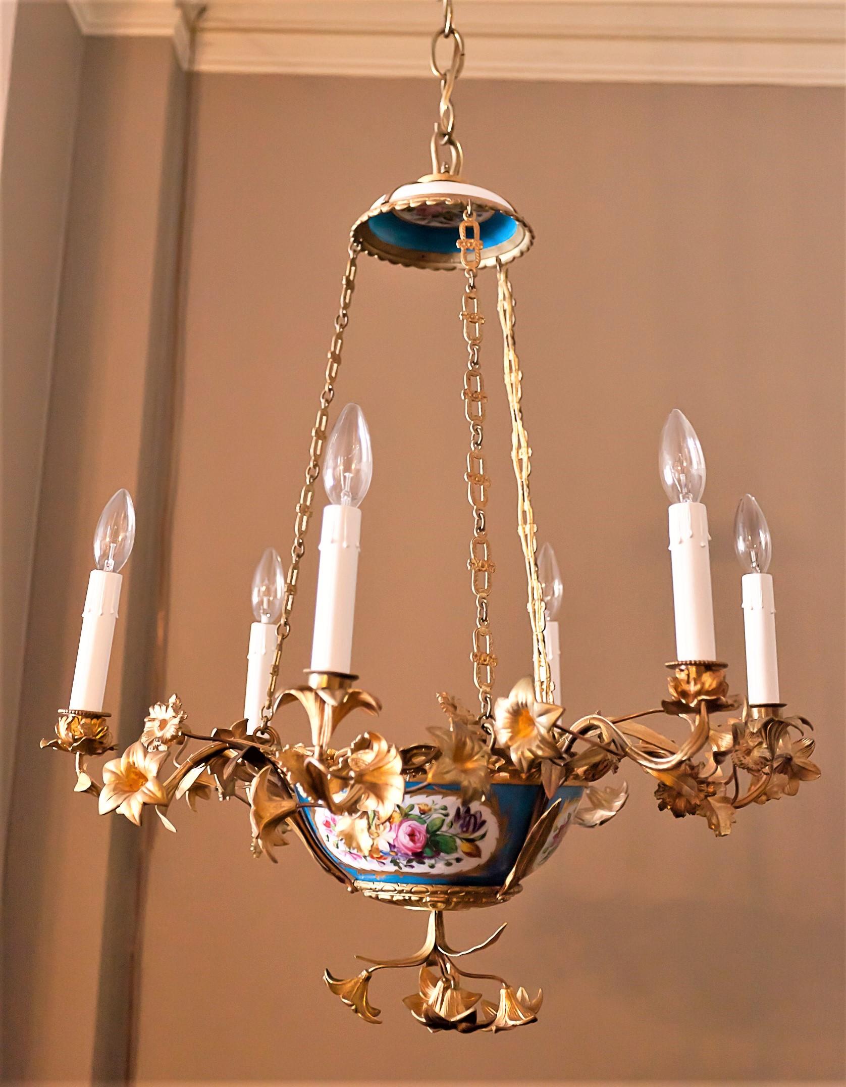 Continental foliate and floral six light fixture with hand-painted porcelain and hand-forged and gilt bronze arms, mounts and chain. Rococo style is copied from mid 18th century France. Ceiling cap, hanging hardware and one foot of chain included.