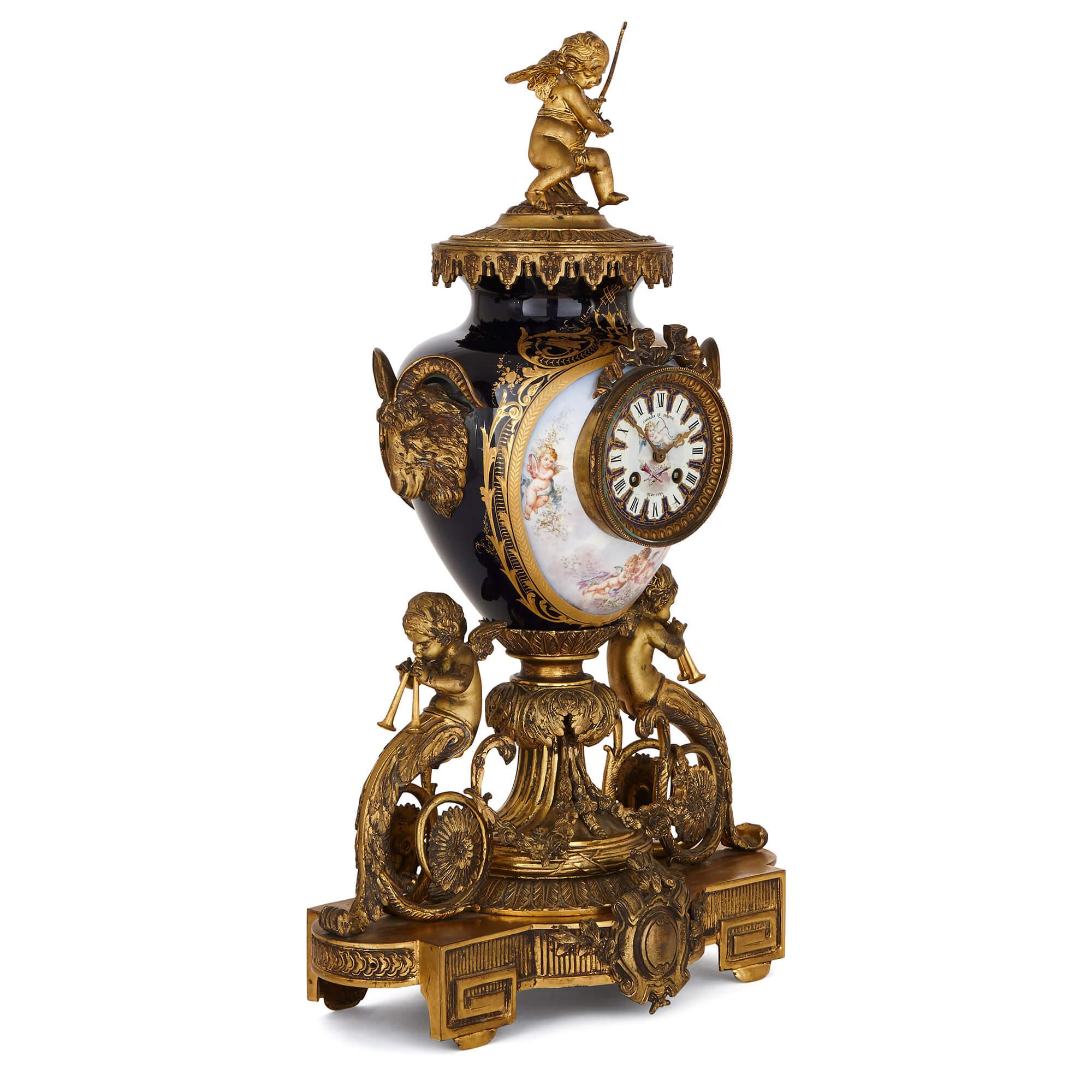 This large and impressive clock garniture set consists of a central clock and a pair of flanking vases. The three pieces are extremely finely decorated with painted cartouches of flying putti, fetes galantes, and floral motifs, on a Sèvres