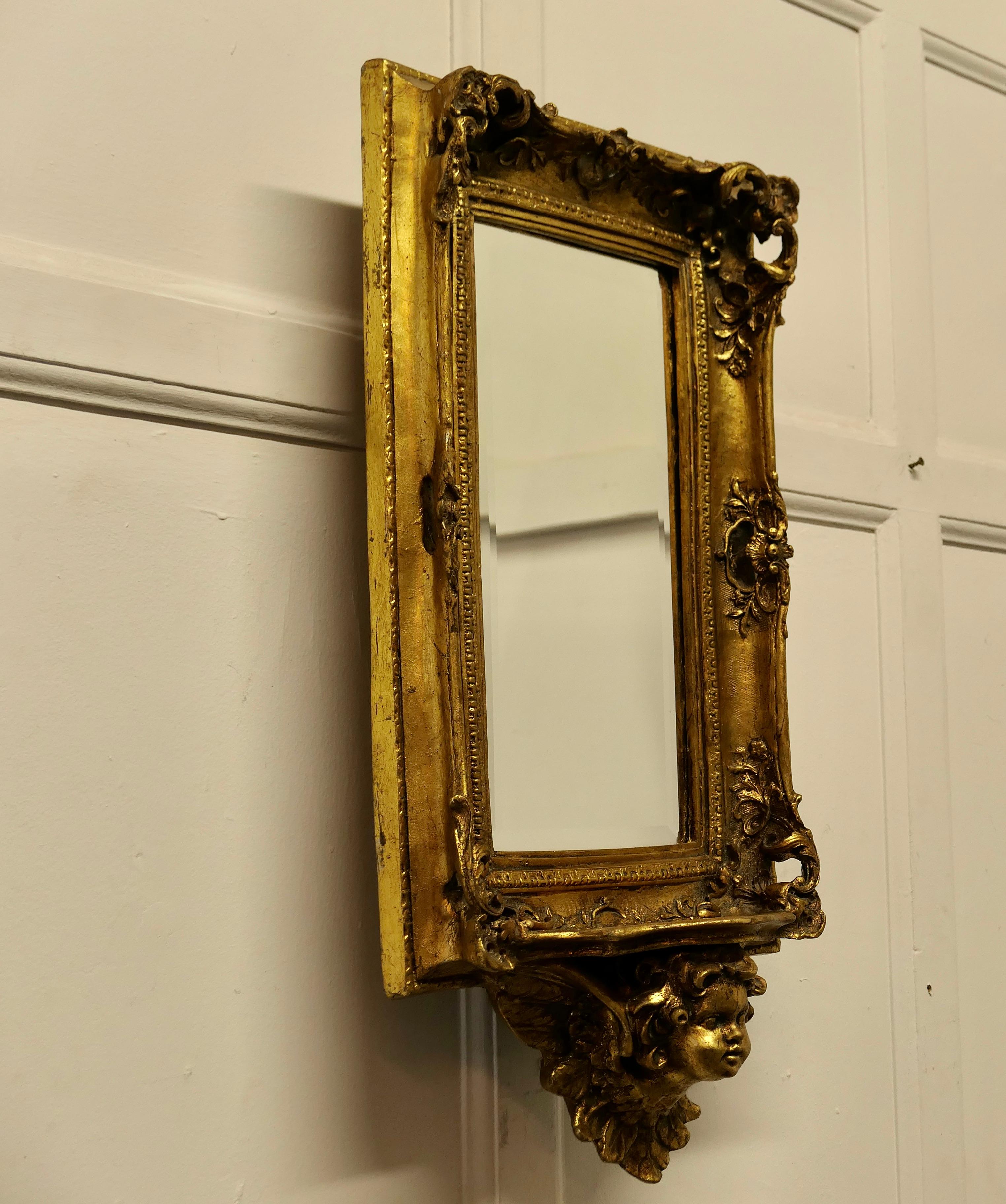 Rococo Revival Rococo Style Gilt Wall Mirror with Putti and Shelf Bracket  For Sale
