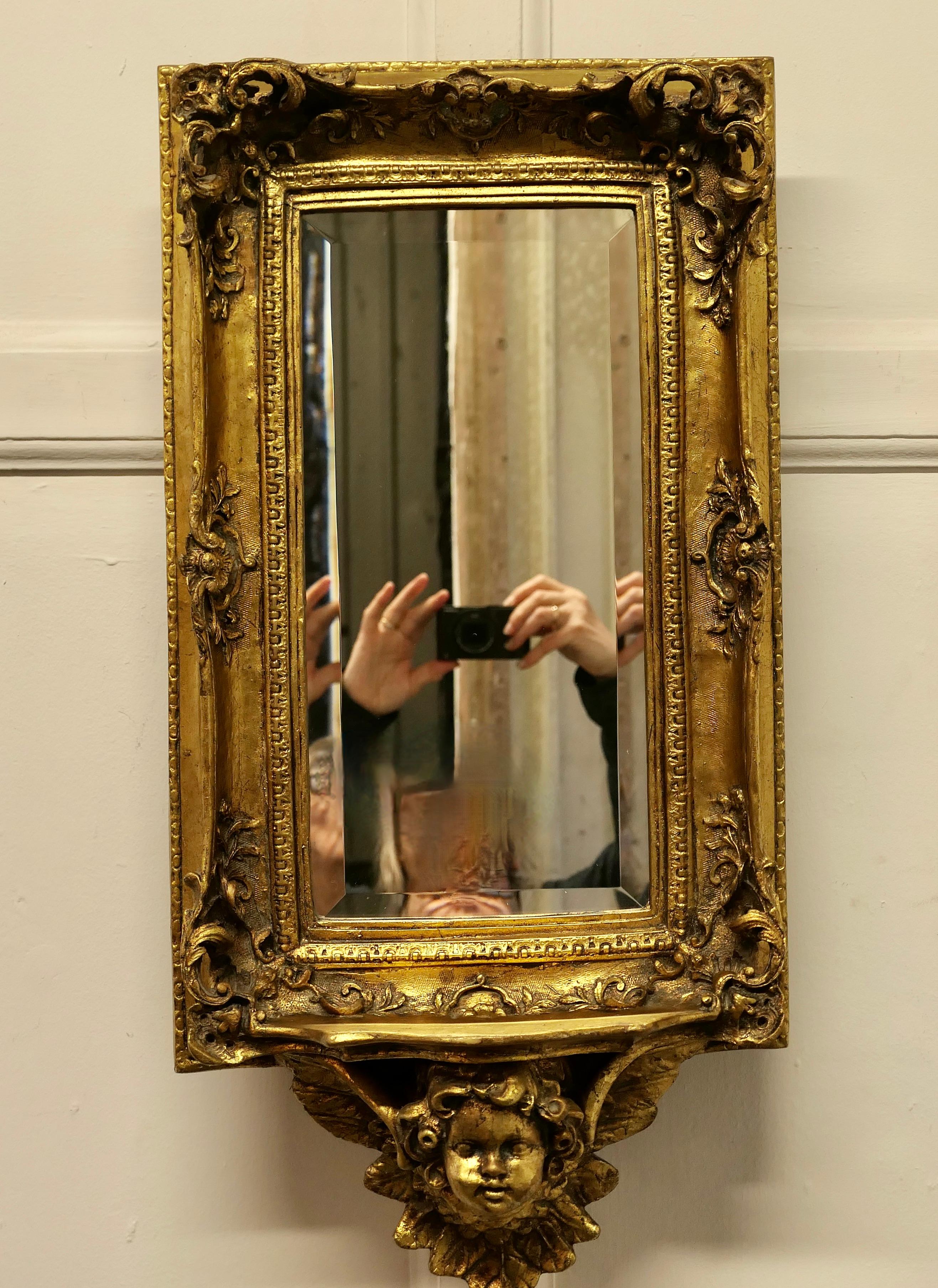 20th Century Rococo Style Gilt Wall Mirror with Putti and Shelf Bracket  For Sale
