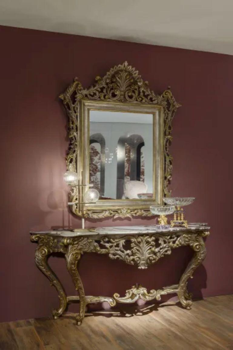 Rococo-inspired mirror characterised by branching ripples in curls and slight floral arabesques surrounding the square Classical-style frame

Materials
Available in an oxidised silver or black patinated finish. Strobo Pine and Jelutong wood frame,