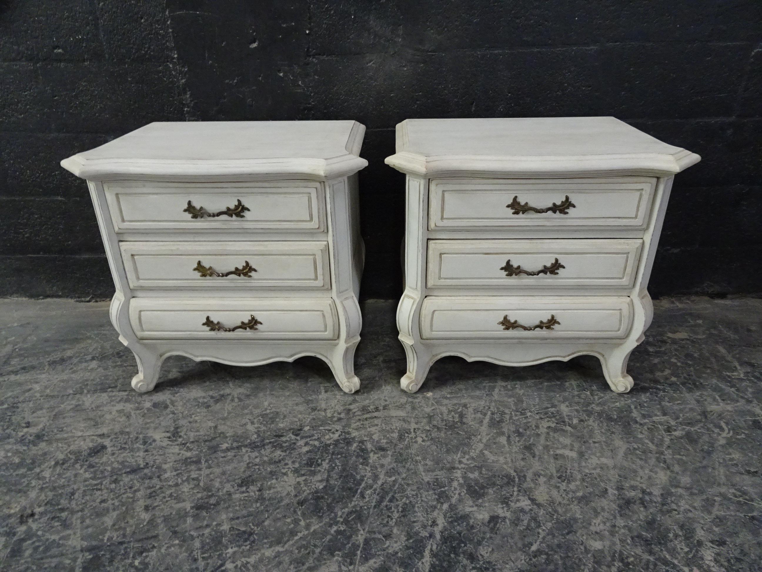 This is a set of 2 Rococo style nightstands. They have been restored and repainted with milk pints 