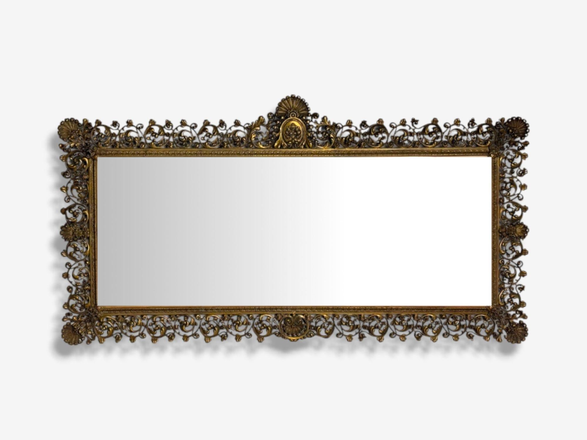 Rococo Style, Patinated Bronze, Large Ornate Mirror, France, 1930s

Solid Bronze horizontal wall or over the mantle mirror designed and produced in France, early 20th century. This example maintains its original beveled mirror panel having light