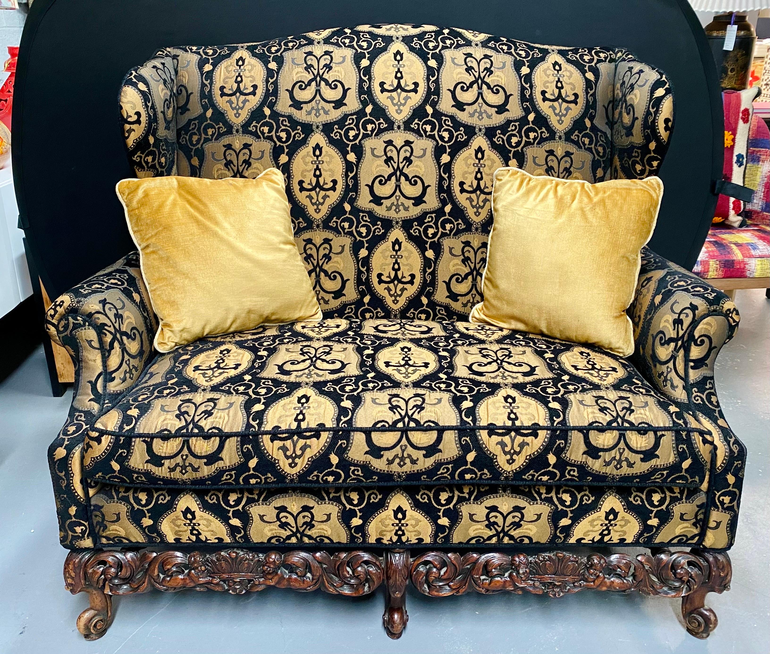 19th-early 20th century settee / canape or loveseat in Rococo style having a fine Fabric. This is simply the finest find of wonderfully covered and carved oversized settee or canape anyone could wish to have. The detailed carvings on the lower frame