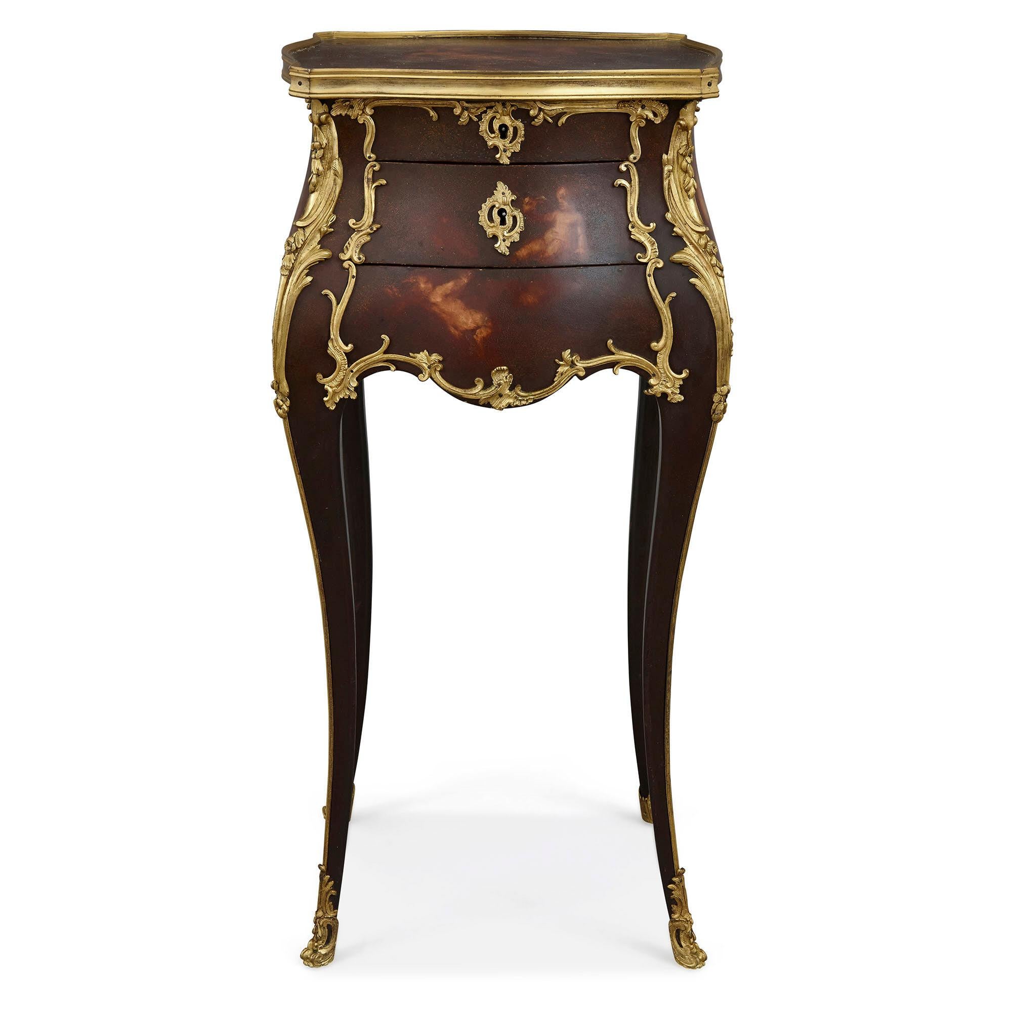 Rococo style side table with vernis Martin decoration and gilt bronze mounts
French, late 19th century
Measures: Height 75cm, width 36cm, depth 36cm

This wonderfully little side table also functional as a petit dressing table is a fine example