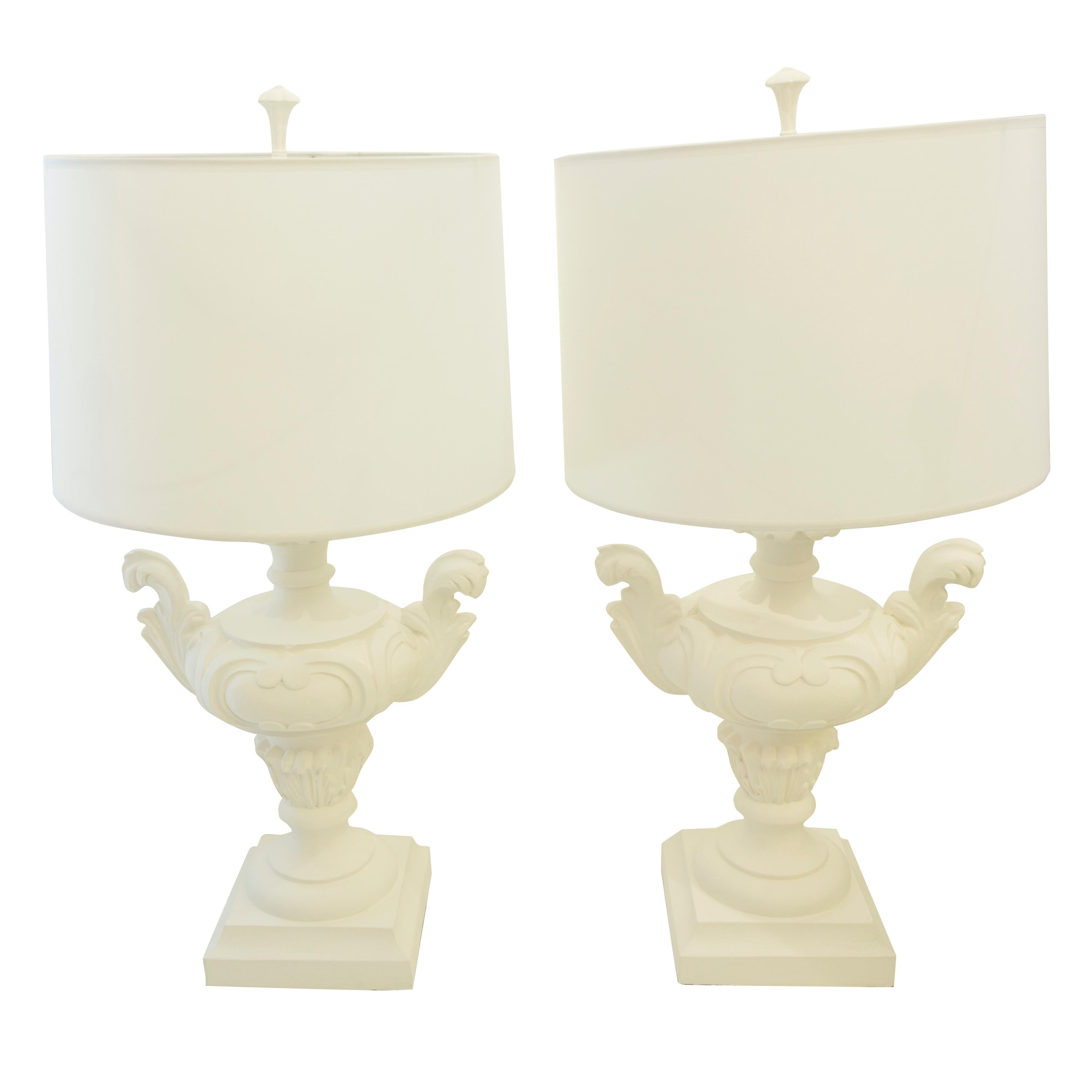 The Rococo table lamps are a pair of vintage table lamps with Corinthian-esque motifs. The decorative body is newly lacquered in matte white unifying the intricate detailing of the design. 

Measurements: 

30” H x 15” W.