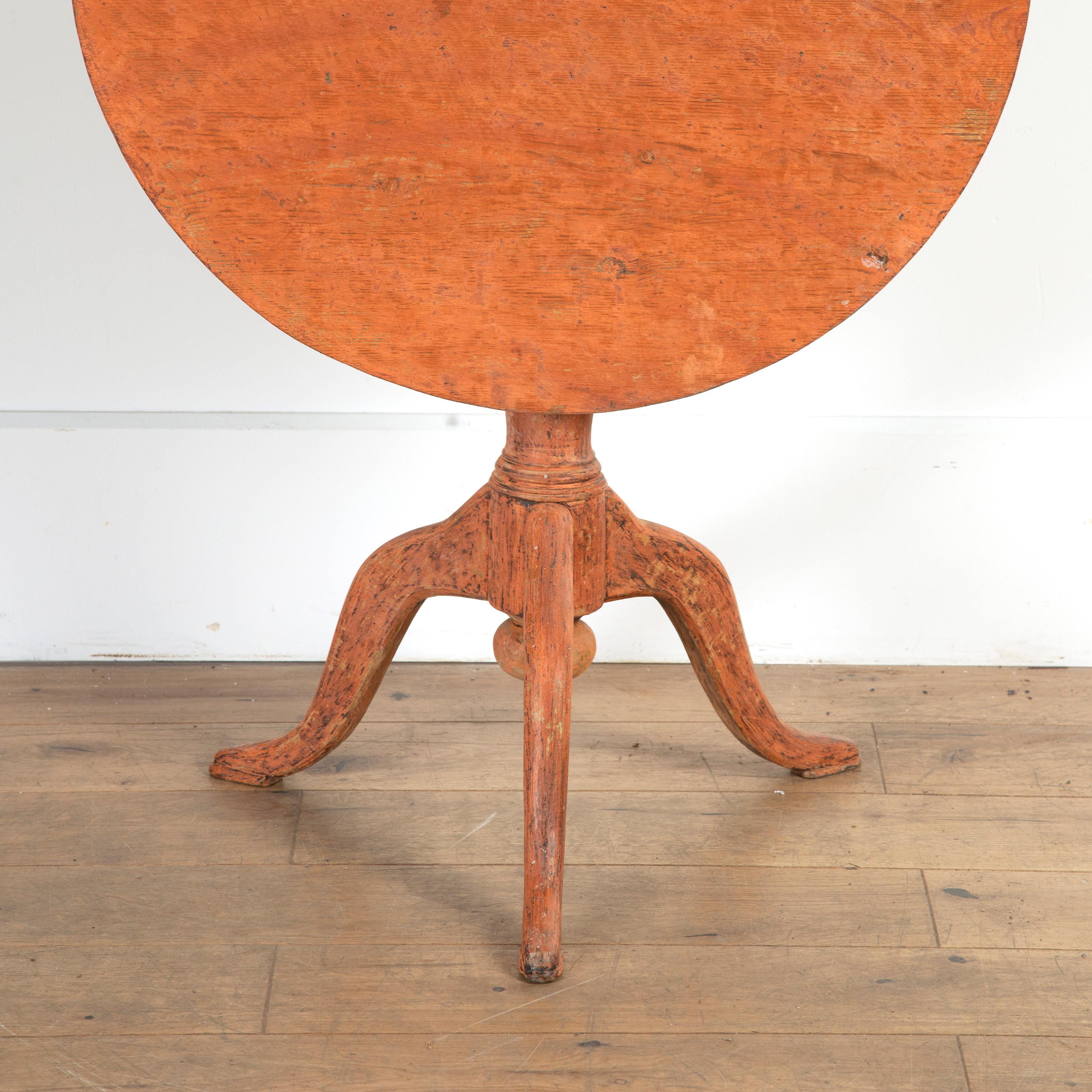 Lovely Swedish rococo period tilt-top table.

This lovely table is in its original condition and dates to the 18th Century. The whole rests on a rusty orange tripod base with cabriole legs and petite feet. 

Its tilt-top, top is in a functional