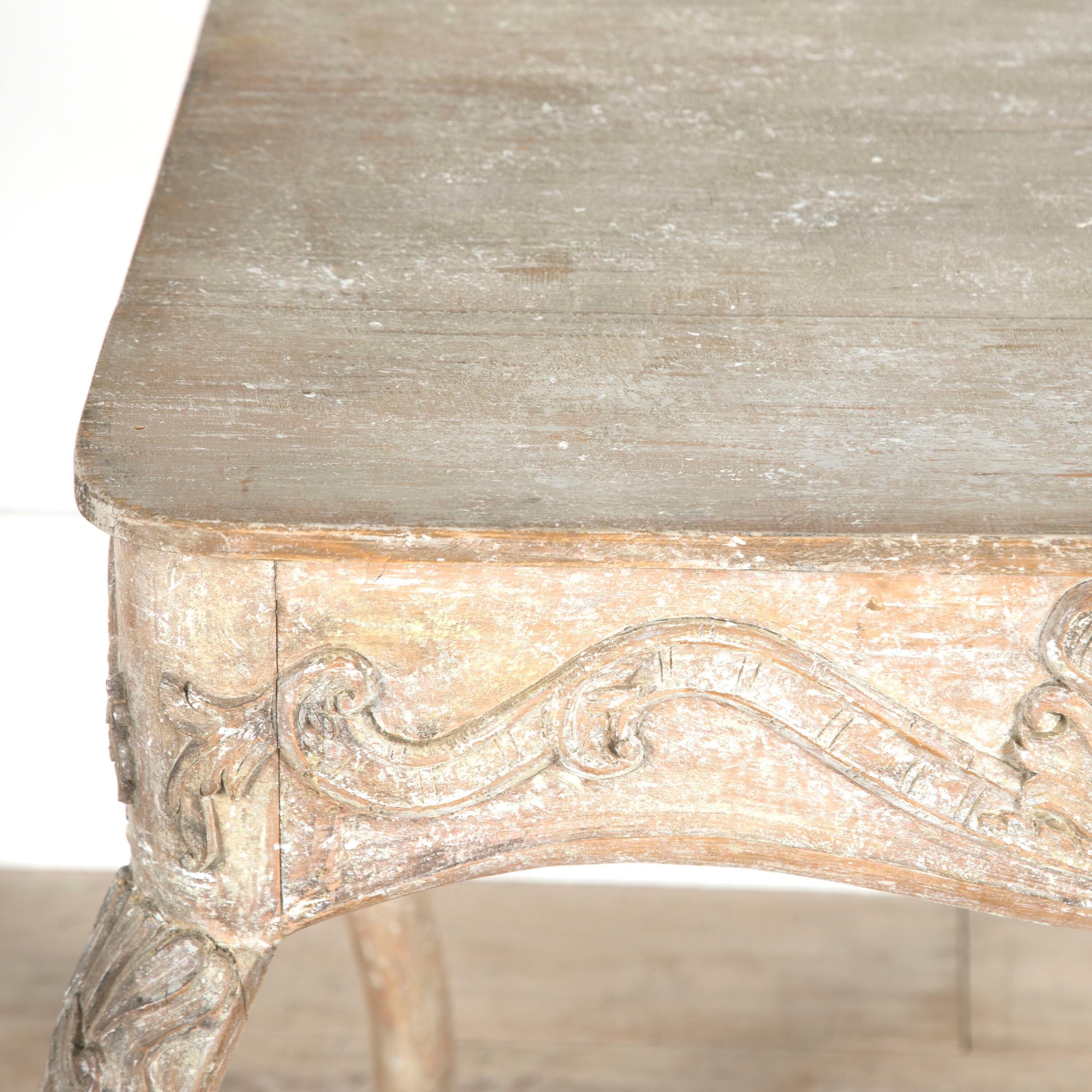 Late 18th Century Rococo tray table with wonderful carvings, dry scraped to it's old paint. Additional top added later.