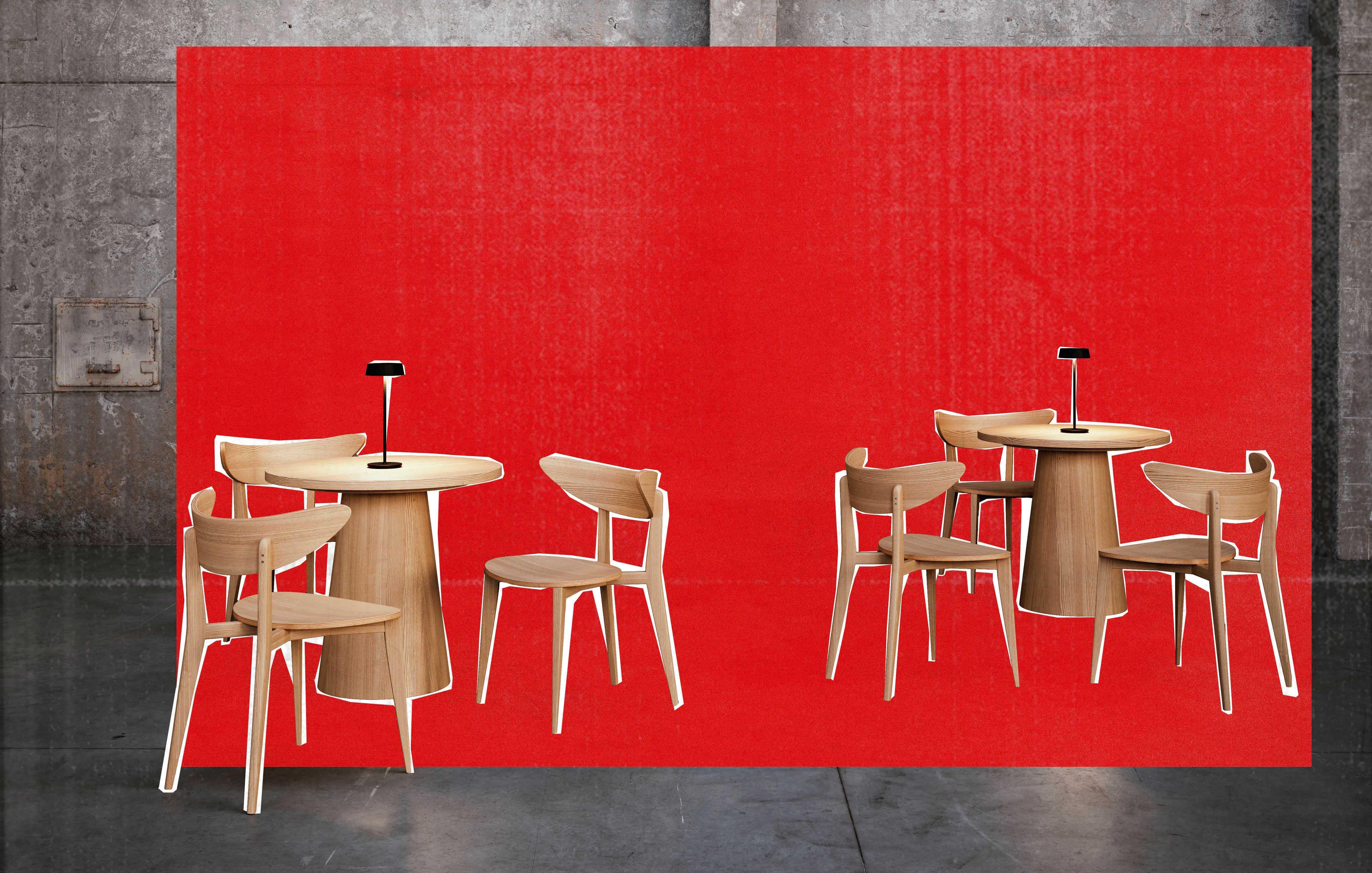 The slender stem connects two imaginary blocks of cement, rising from the base and supporting the shade, which hosts the LED light source. To adjust the level of light, the user can simply touch the top of the shade.
Small yet robust, the lamp is