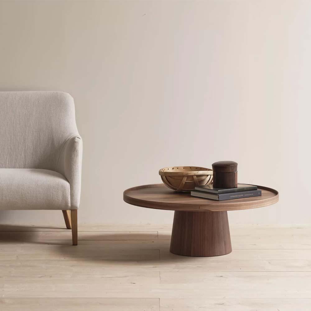 The Rodan coffee table : rigorous simplicity & comfort

Rodan is inspired by the restraint and detailing of the iconic Shaker box. The table marries a turned, solid wood and very stable base, upon which sits the top, whose lip is then secured with