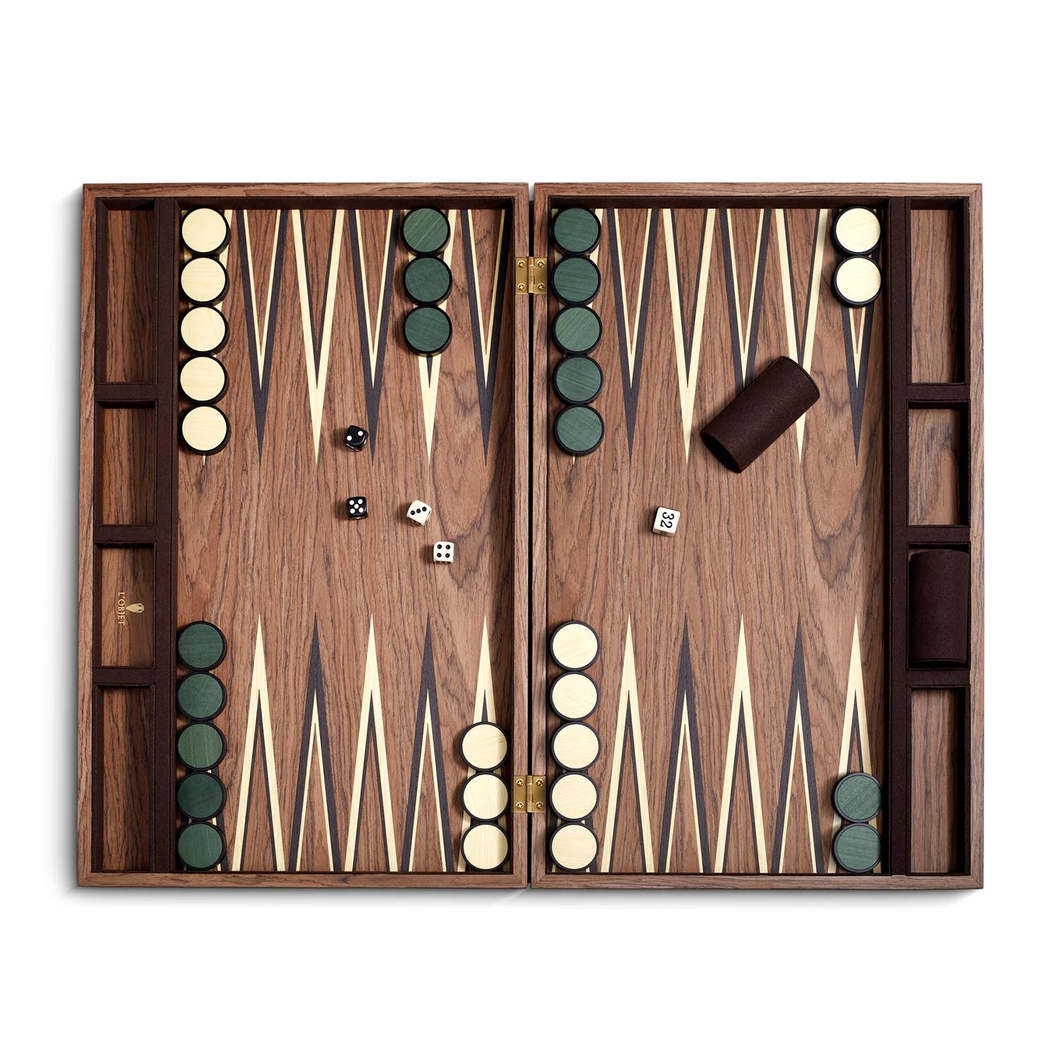 Backgammon Rodan Walnut with all structure in solid ash wood
in walnut stained finish, with pawns made with ivory and with suede 
leather backing in english green color.
Dimensions of the games closed box: L49 x D31 x H6cm.
Dimensions of the