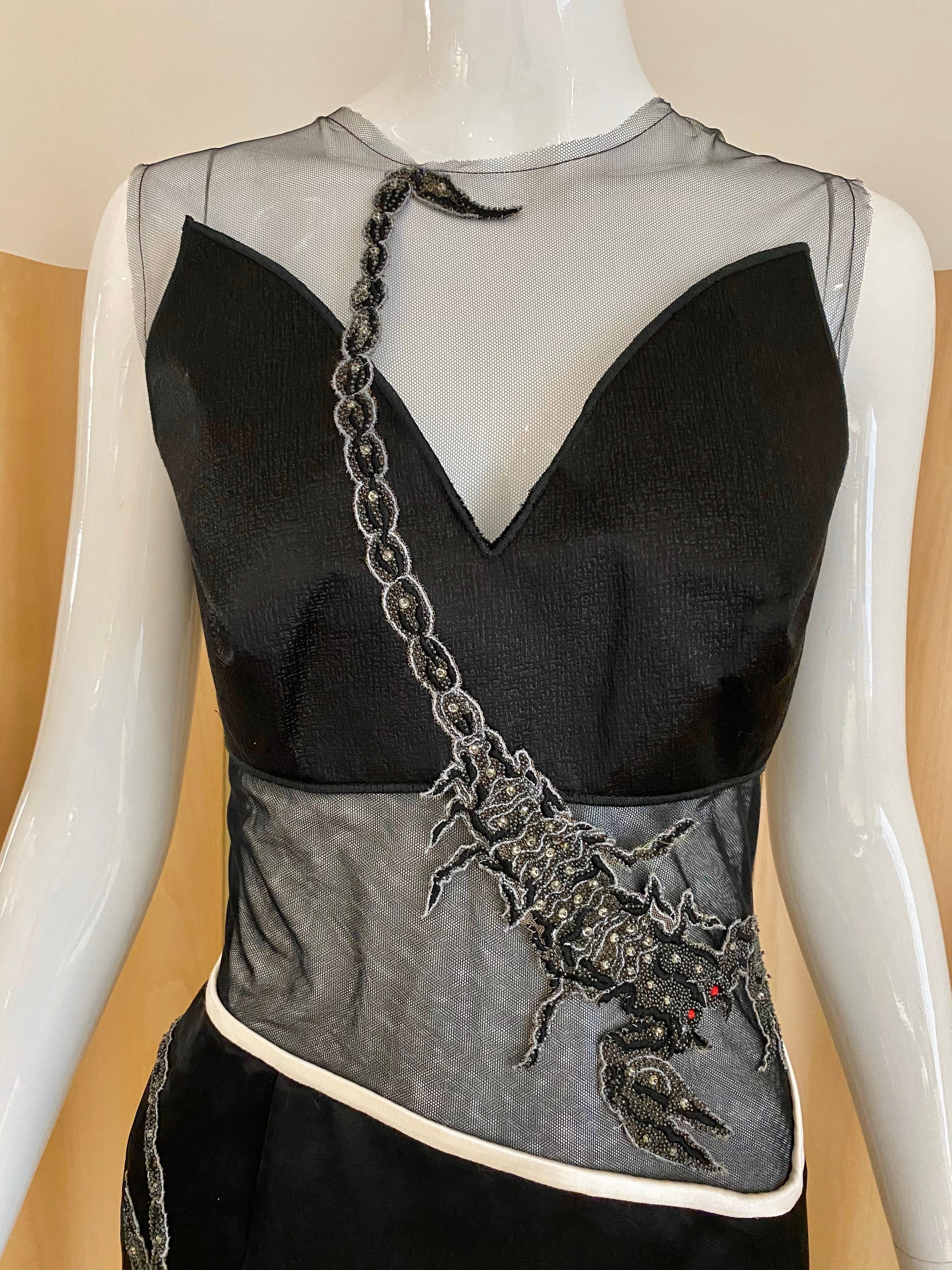 Beautiful Rodarte sleeveless black silk dress with sheer netting and embroidery.
Dress in excellent condition. 
