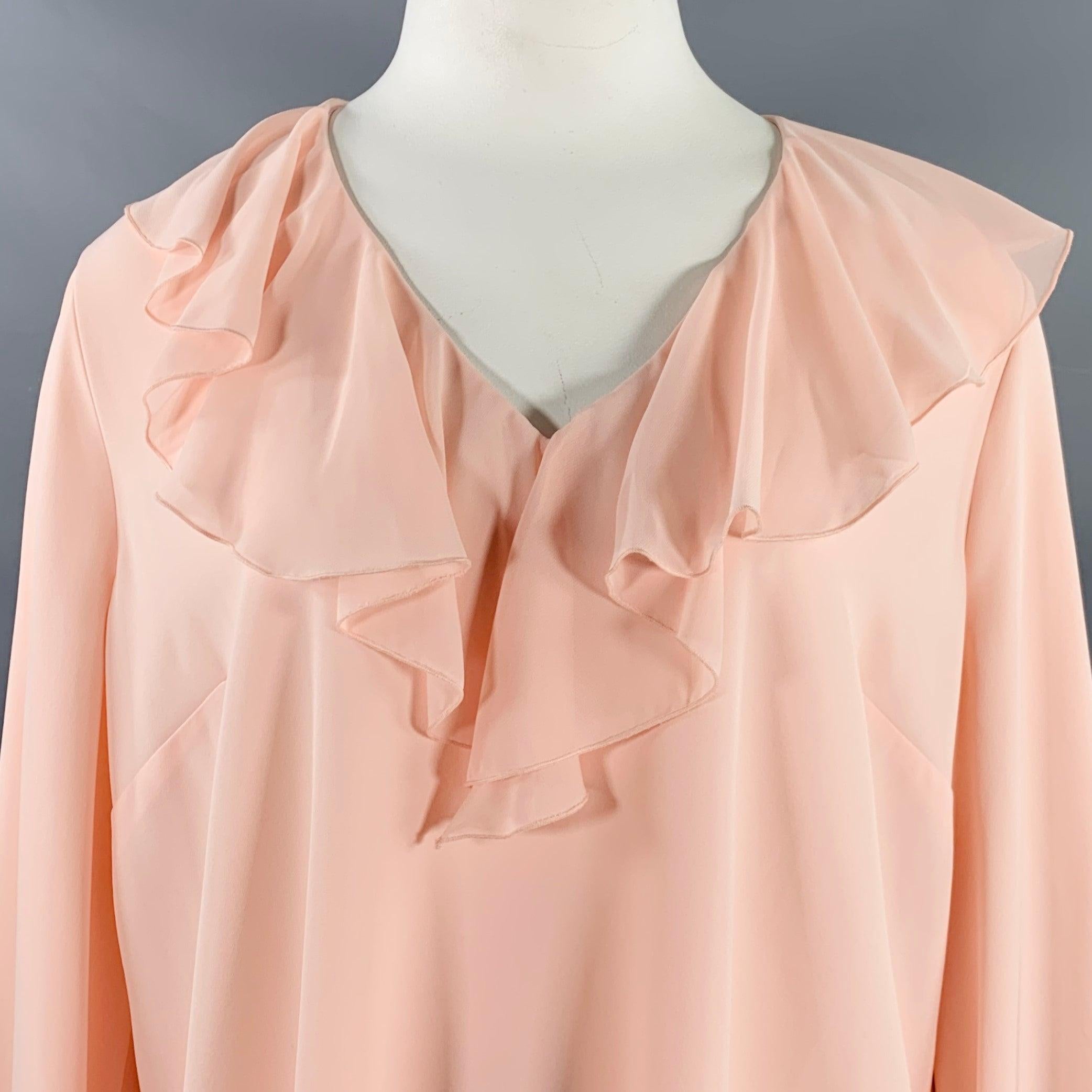 RODARTE x UNIVERSAL STANDARD blouse
in a pink polyester blend jersey featuring ruffles at neck and cuffs, V-neck, and tie closure. Note: this plus size garment uses UNIVERSAL STANDARD's system of inclusive sizing, please double check