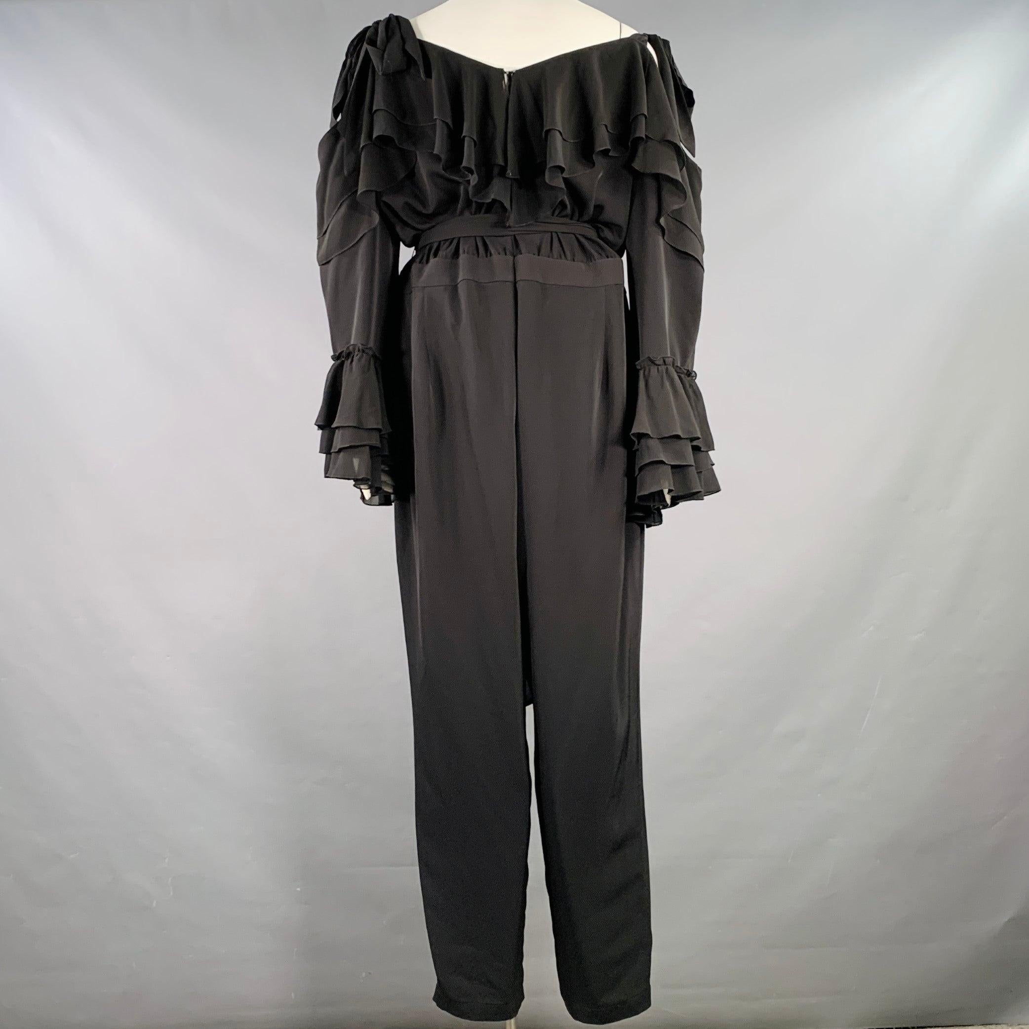 RODARTE x UNIVERSAL STANDARD jumpsuit
in a
black polyester blend jersey featuring ruffles at neck and cuffs, a cold shoulder design, and back zipper closure with belt. Note: this plus size garment uses UNIVERSAL STANDARD's system of inclusive