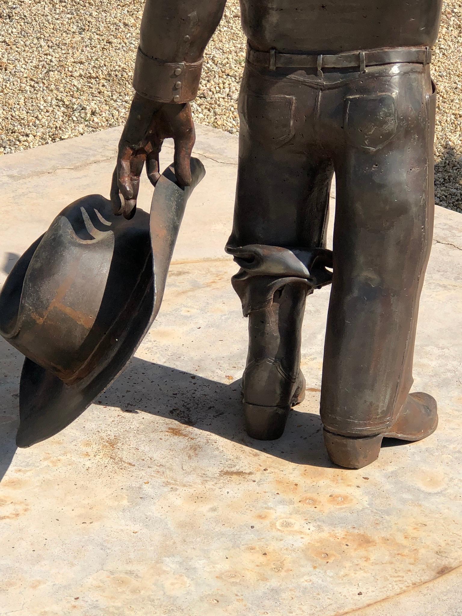 Howdy, by Rodger Jacobsen,  steel sculpture, cowboy, stetson hat, boots, Texas 9