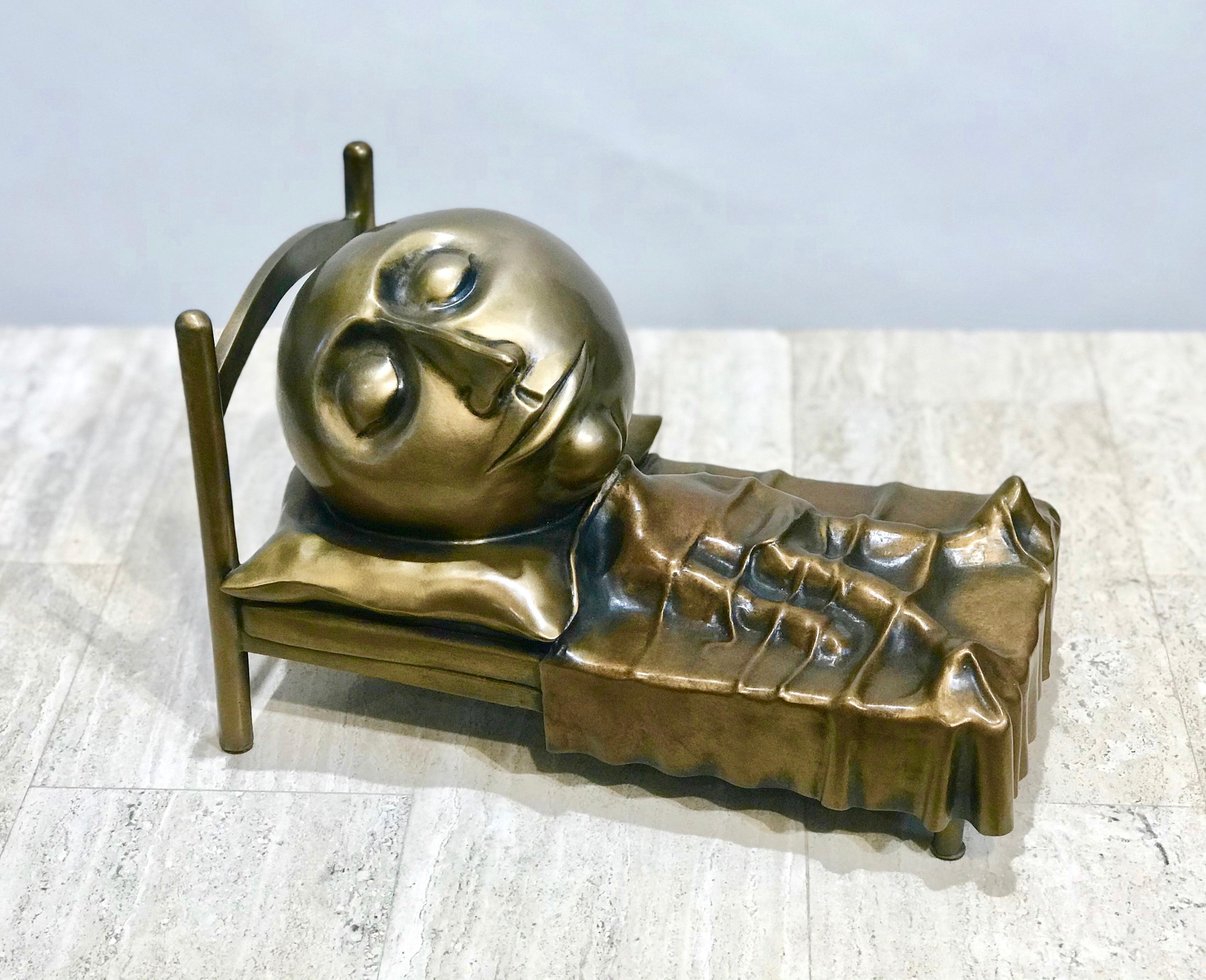 Slumber, sculpture en bronze de Rodger Jacobsen représentant un homme maigre couché avec une grande tête en vente 1