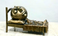 Slumber, Rodger Jacobsen bronze sculpture skinny man sleeping bed with big head