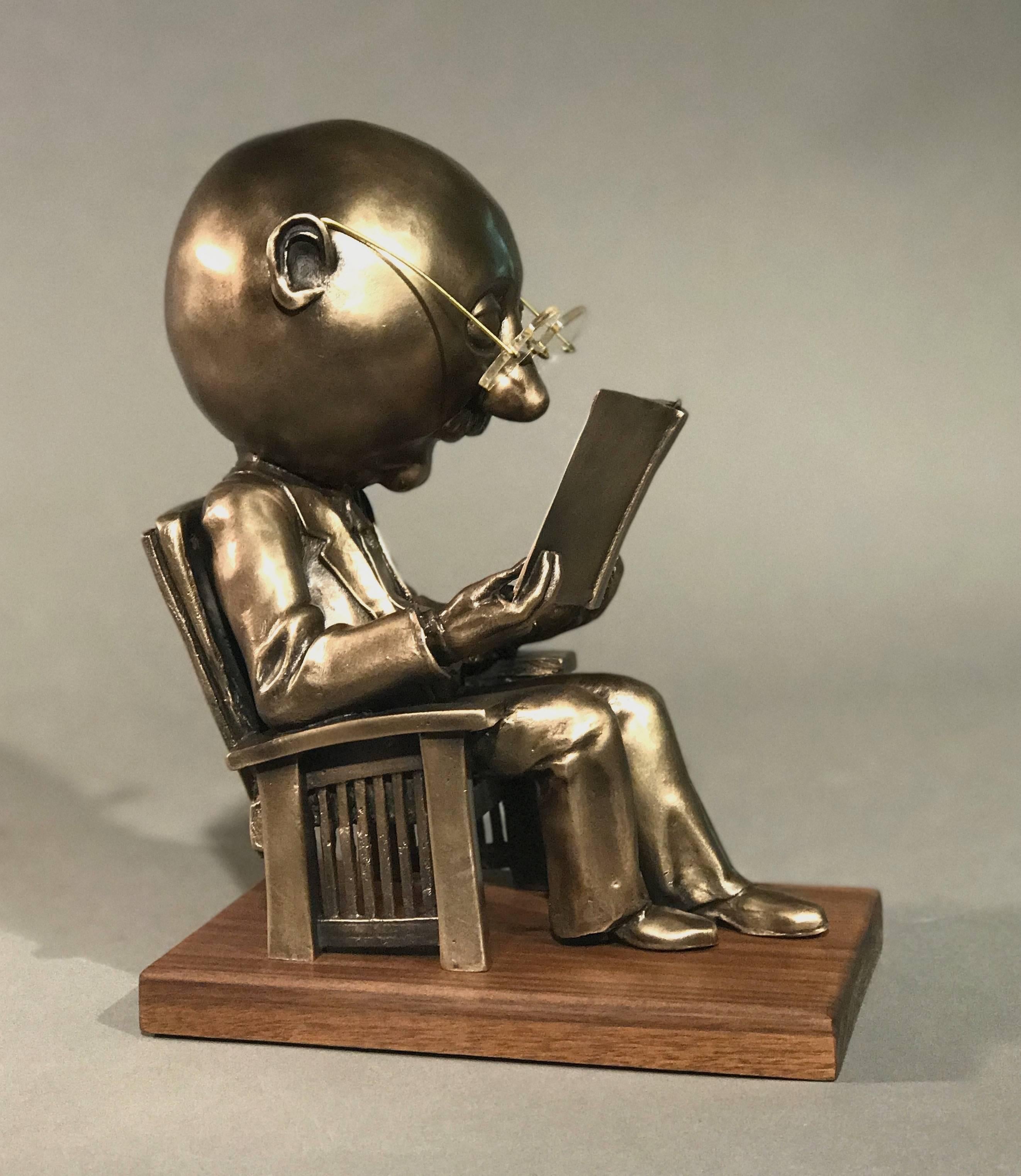 The Reader (small), gold bronze sculpture, reading book, glasses, Rodger Jacobsen 1