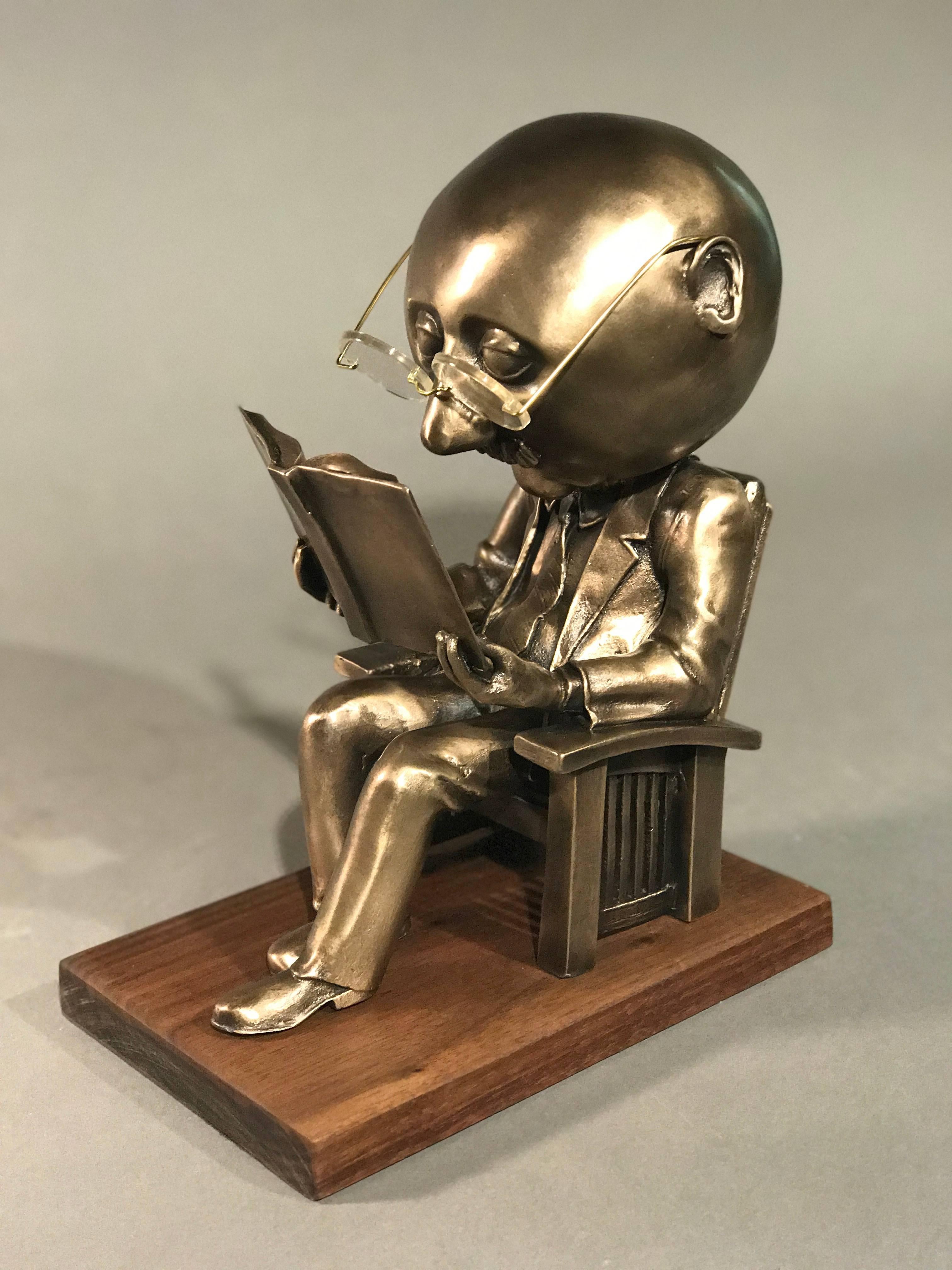 The Reader (small), gold bronze sculpture, reading book, glasses, Rodger Jacobsen 2