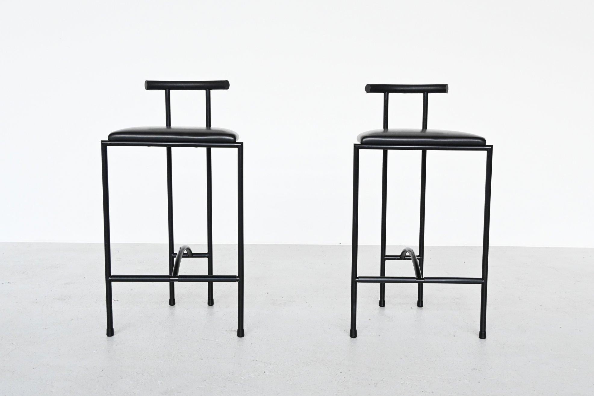 Beautiful pair of Tokyo bar stools designed by Rodney Kinsman for Bieffeplast, Italy, 1985. They have Japanese inspired forms. The stools have a black painted tubular metal frame, a black rubber back rest and black faux leather upholstered seat.