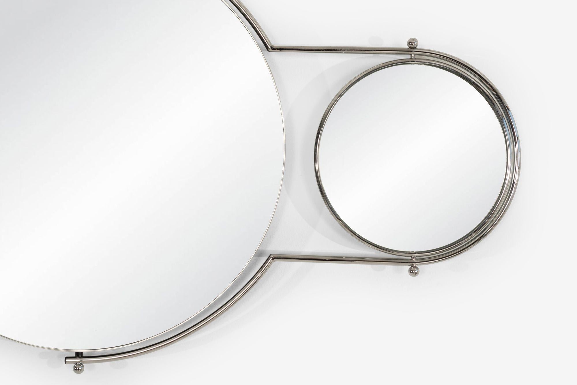 Rodney Kinsman Orbit Mirror for OMK, 1981
Designed by Rodney Kinsman in 1981 and produced by OMK, the Orbit Mirror combines functional design with playful movement inspired by a satellite orbiting a planet. The piece features a chrome-plated metal