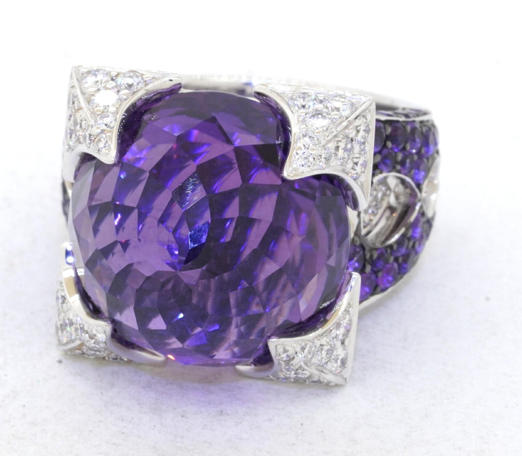 Rodney Rayner 18k white gold 35.40ct amethyst and diamond dragon ring size 6.75. This sensational ring is made from solid 18k white gold and features both diamond and amethyst gemstones. The center stone of the ring is a huge 30ct vortex cut