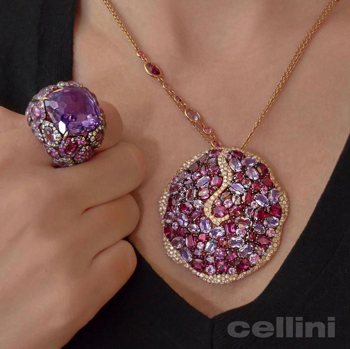 Rodney Rayner is known for his unique styling and use of beautiful color combinations. This 18 karat rose gold pendant necklace is a perfect example of his work. Various shades of oval rhodolite and amethyst stones are set in the organic shaped