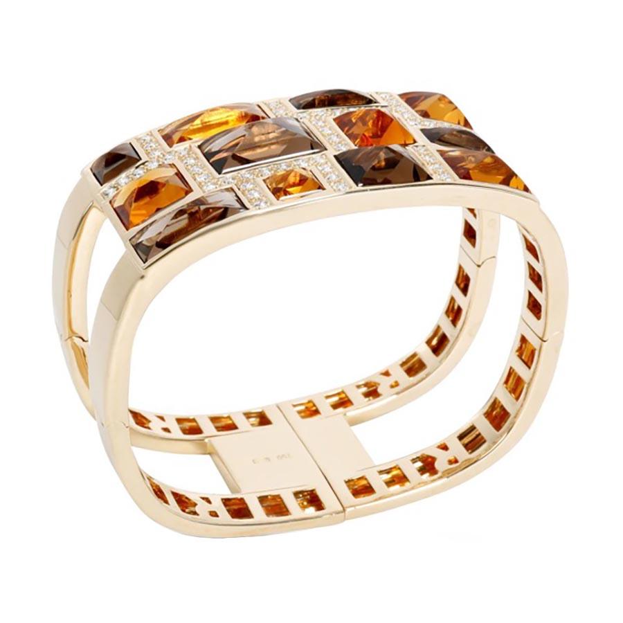 Rodney Rayner Citrine Smoky Topaz and Diamond Bangle Bracelet. This stunning bracelet is a masterpiece by renowned designer Rodney Rayner, celebrated for his bold use of gemstones and intricate designs. The bangle cuff features a captivating