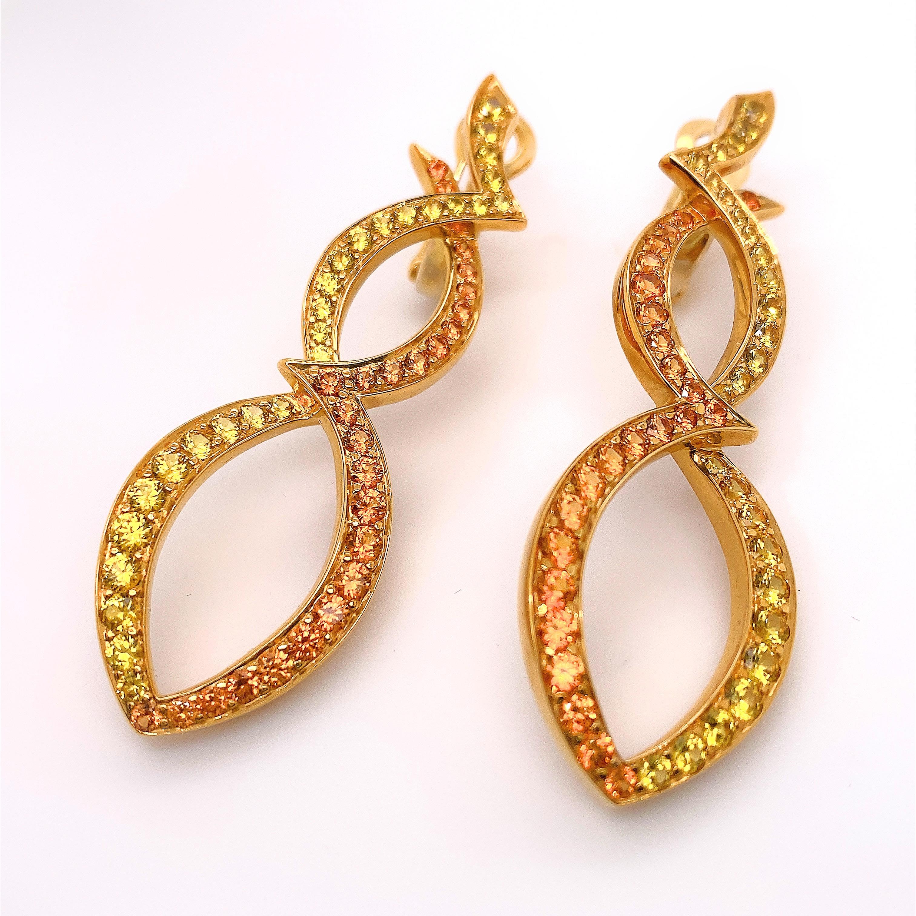 RODNEY RAYNER Earrings
Round Cut Orange Sapphires & Green Tsavorites
Style:  Clip on with Post for Pierced Ears
Metal:  18kt Yellow Gold
Size / Measurements:  2' Inches Length - 1/5 inch Wide
Hallmark:  750 RAYNER
Includes:  Elegant Earring
