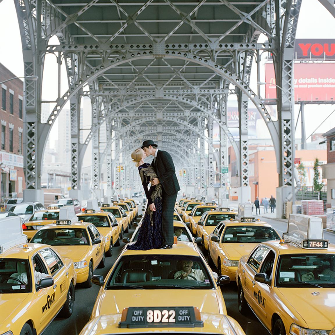 Rodney Smith Color Photograph - Edythe and Andrew Kissing on Top of Taxis, New York City, NY