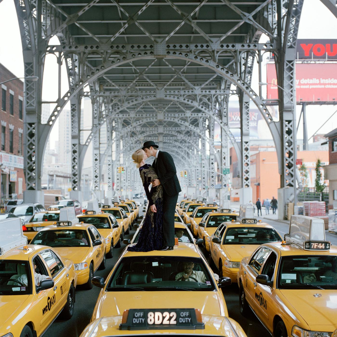 Rodney Smith Figurative Photograph - Edythe and Andrew Kissing on Top of Taxis, New York, New York - 20 x 20 inches