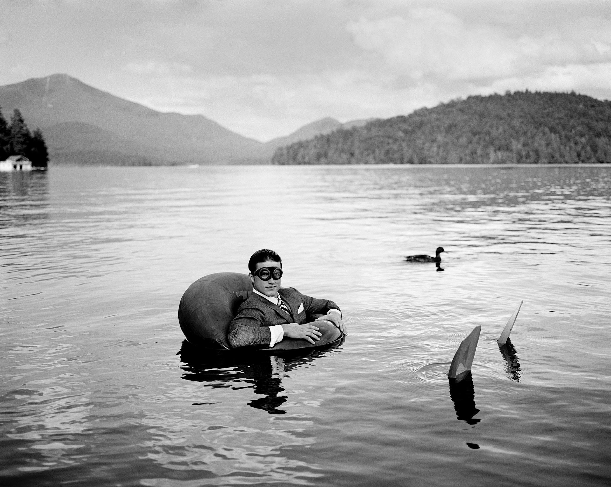 Rodney Smith Black and White Photograph - James in Innertube with Duck, Lake Placid, New York - 20 x 25 inches