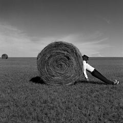 Man Leaning Against Hay Bale, Alberta, Canada - 28 x 28 inches framed