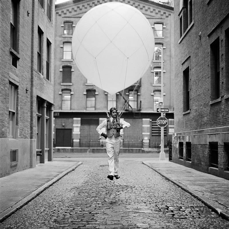 Rodney Smith Black and White Photograph - Reed Floating with Balloon, New York, New York - 20 x 20 inches