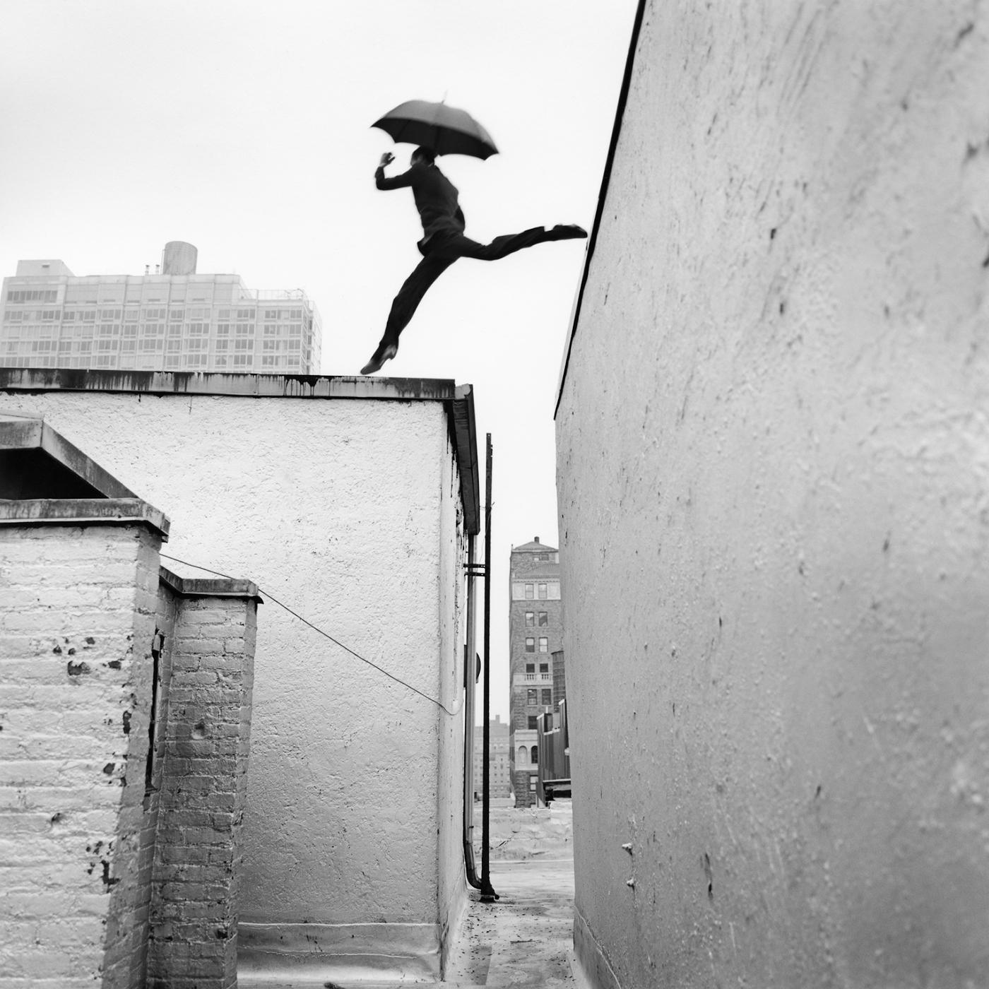 Rodney Smith Black and White Photograph - Reed Leaping Over Rooftop, New York, New York - 40 x 40 inches