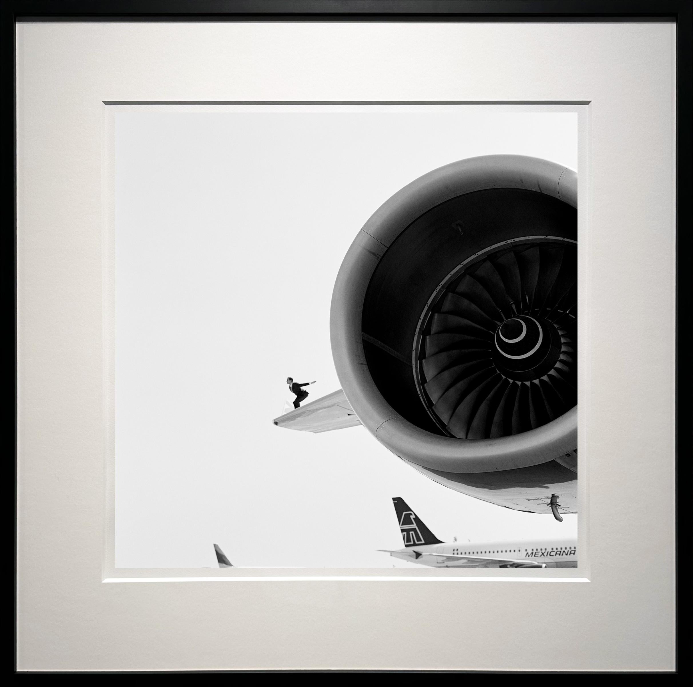 Reed perched on airplane wing, JFK, New York - 20 x 20 inches - Photograph by Rodney Smith