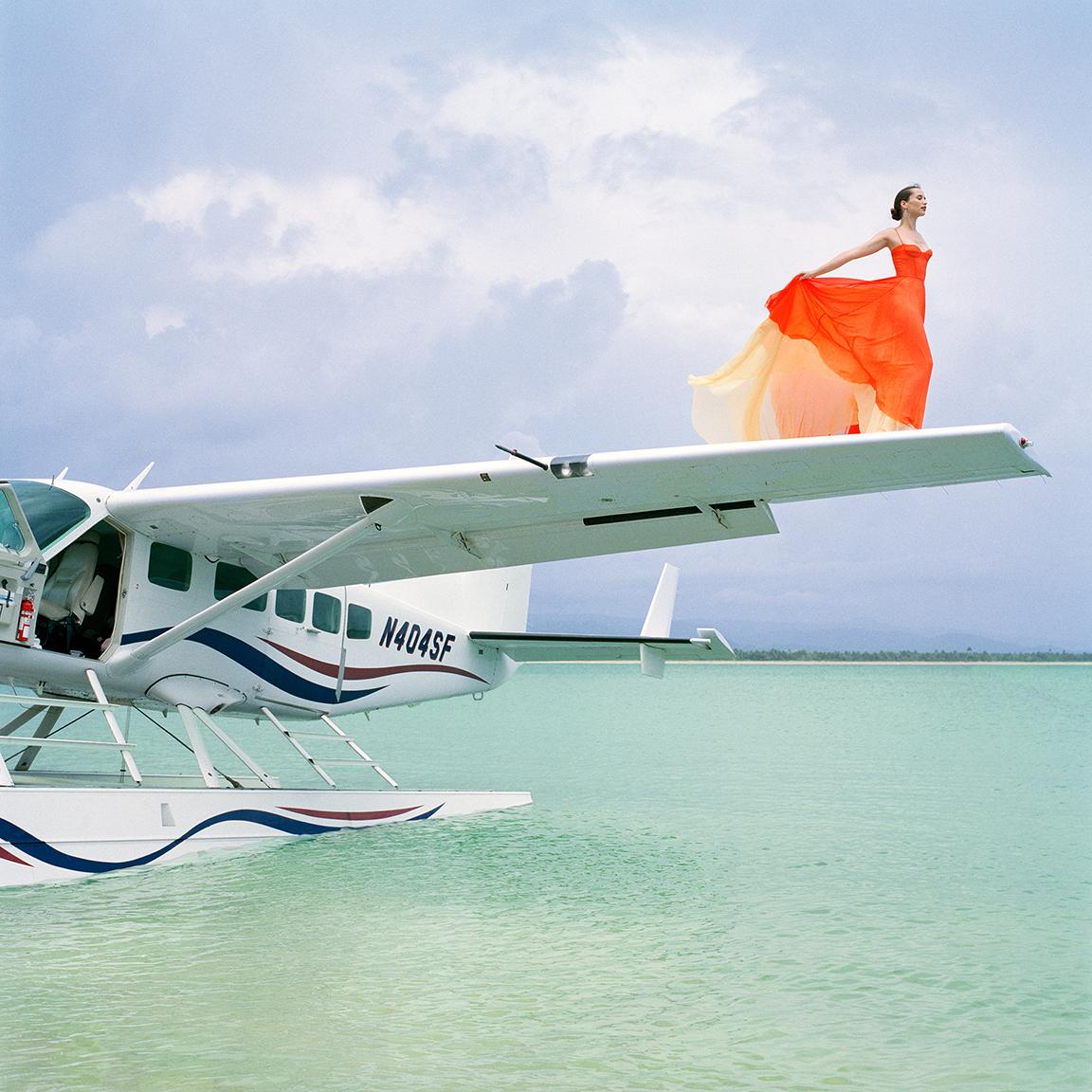 Rodney Smith Color Photograph - Saori on Sea Plane Wing No. 2, Dominican Republic, 2010