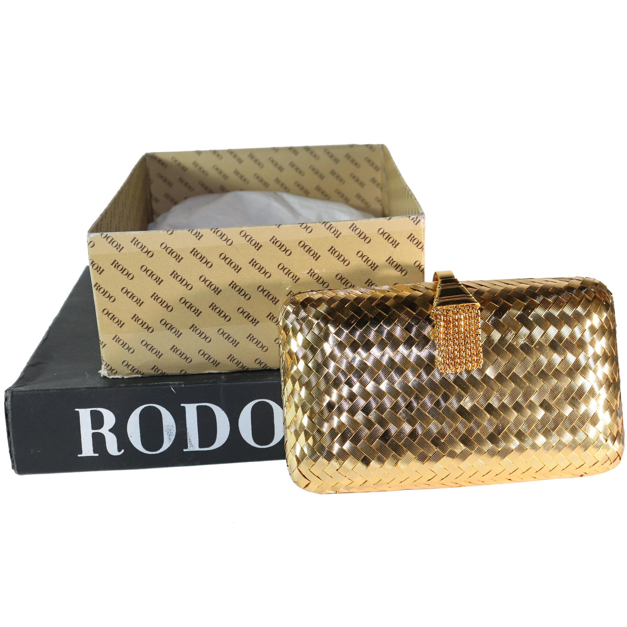 Rodo Golden Minaudière Handbag with Shoulder Chain. In excellent condition,

Measurements:

Height - 5.2 Inches 
Width - 8.5 Inches 
Height with Chain - 25.3 Inches '
