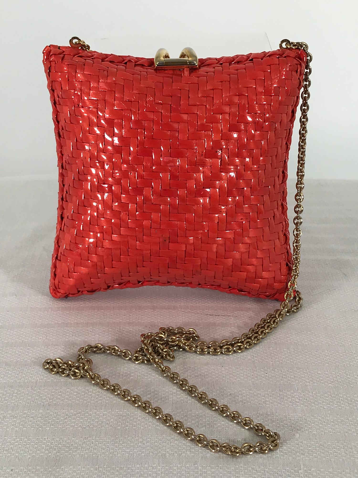 RODO Italy square orange wicker, thin gold chain shoulder bag from the 1970s.
Pillow shaped square wicker bag with a glazed orange finish, Long thin gold shoulder length chain. The bag closes with a gold metal flip over clasp, there is wear to the